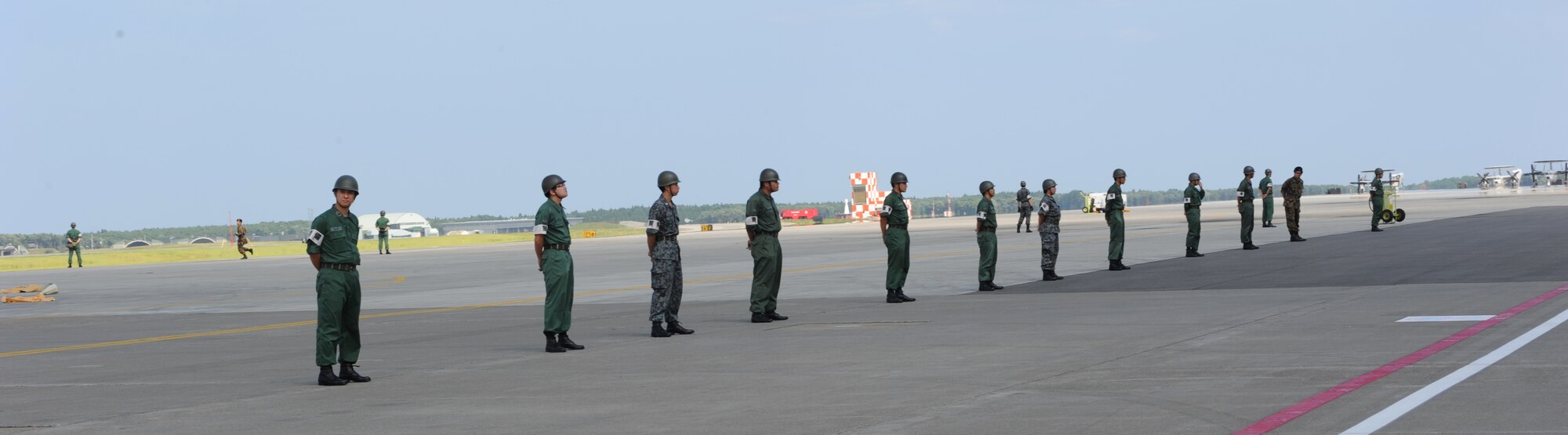 Members of the Japan Air Self-Defense Force set up a cordon around a simulated aircraft crash site during a major accident response exercise at Misawa Air Base, Japan, Aug. 30, 2012. Misawa AB and the Japan Air Self-Defense Force combined efforts during the exercise, which was geared to prepare the base in the event of a mishap during the Misawa Air Festival scheduled for Sept. 9. (U.S. Air Force photo by Airman 1st Class Kia Atkins/Released)