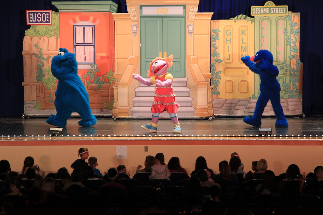 A kid-packed audience dances along to a song during the Sesame Street / USO Experience for Military Families show Aug. 22, 2012.