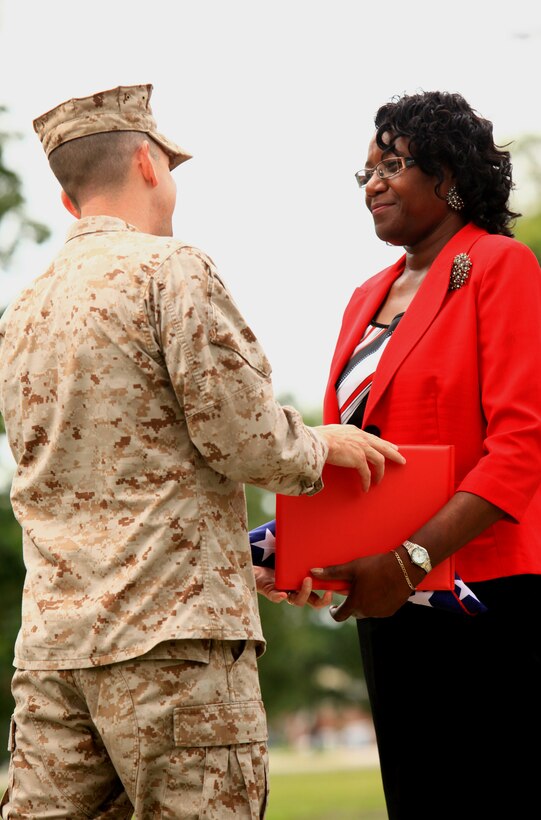 Maj. Brian Turner, a financial management officer with Combat Logistics Regiment 27, 2nd Marine Logistics Group, presents Jacquelyn W. Southerland, a financial technician supervisor with 2nd MLG’s disbursing office, with a citation for her 33 years of service in a retirement ceremony aboard Camp Lejeune, N.C., Aug. 30, 2012. Southerland officially retired after dedicating more than half of her life to serving the financial needs of servicemembers. 