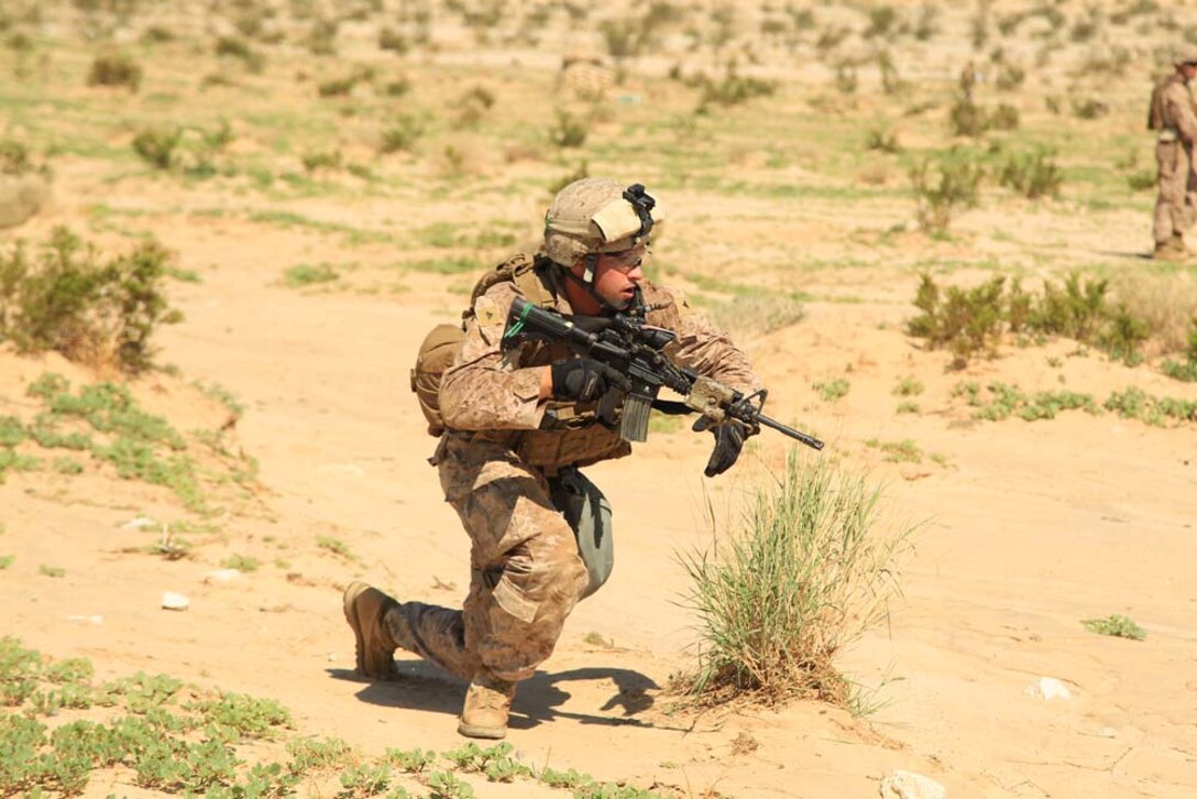Lance Cpl. Joseph Swope, antitank missileman, Weapons Company, 1st Battalion, 4th Marine Regiment, shoots rounds down range Aug. 18, 2012, during the culminating exercise of his unit's Tactical Small Unit Leaders Course at Range 105. The Marines arrived at the Combat Center more than a week ago and learned how to become effective team leaders. After finishing their final exercise, the unit packed up to return to Marine Corps Base Camp Pendleton, Calif., where they will take their positions as small unit leaders.