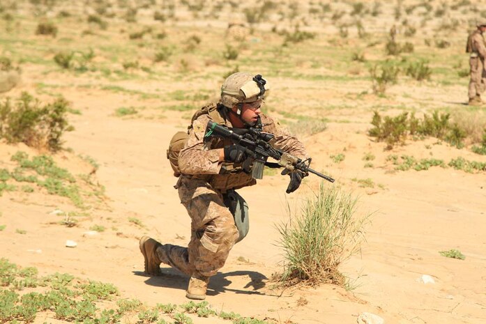 Lance Cpl. Joseph Swope, antitank missileman, Weapons Company, 1st Battalion, 4th Marine Regiment, shoots rounds down range Aug. 18, 2012, during the culminating exercise of his unit's Tactical Small Unit Leaders Course at Range 105. The Marines arrived at the Combat Center more than a week ago and learned how to become effective team leaders. After finishing their final exercise, the unit packed up to return to Marine Corps Base Camp Pendleton, Calif., where they will take their positions as small unit leaders.