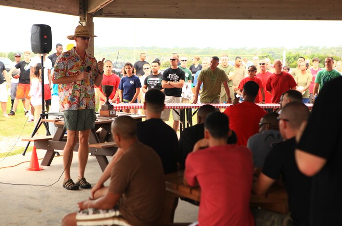 Col. Mark Hollahan, the commanding officer for Combat Logistics Regiment 27, 2nd Marine Logistics Group, addresses the regiment’s personnel before kicking off a beach bash aboard Camp Lejeune, N.C., Aug. 30, 2012. The event drew four of the regiment’s companies together for team-building events and friendly competition.