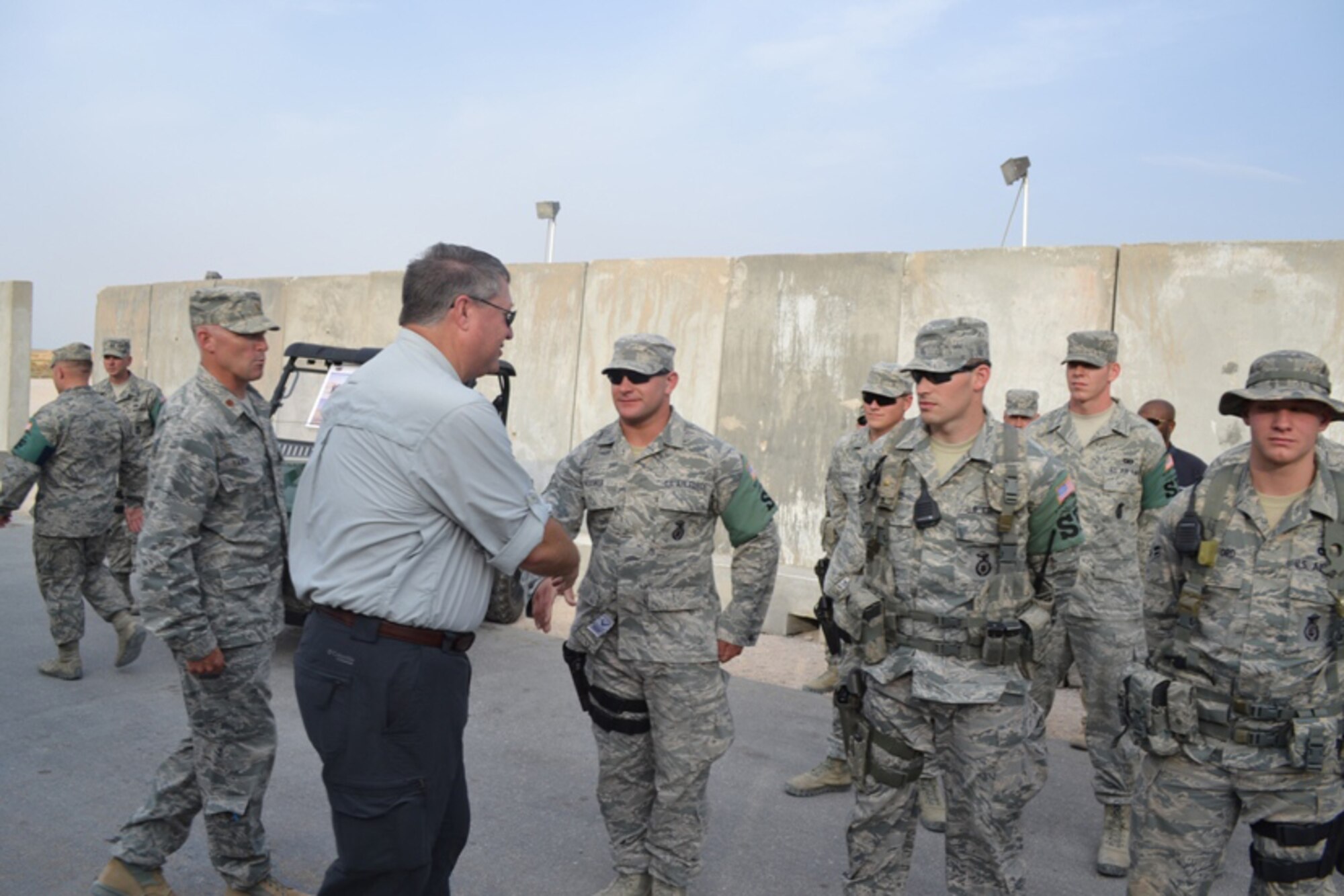SOUTHWEST ASIA – Secretary of the Air Force Michael B. Donley visits with members of the South Dakota Air National Guard’s 114th Security Forces Squadron during a recent visit to Southwest Asia Aug. 24, 2012.  The 114th SFS, based out of Joe Foss Field in Sioux Falls, S.D., has been deployed since April and has been providing law enforcement, troop escort and security work within a base in Southwest Asia. (U.S. Air Force photo by 405th Expeditionary Security Forces Squadron) (RELEASED)