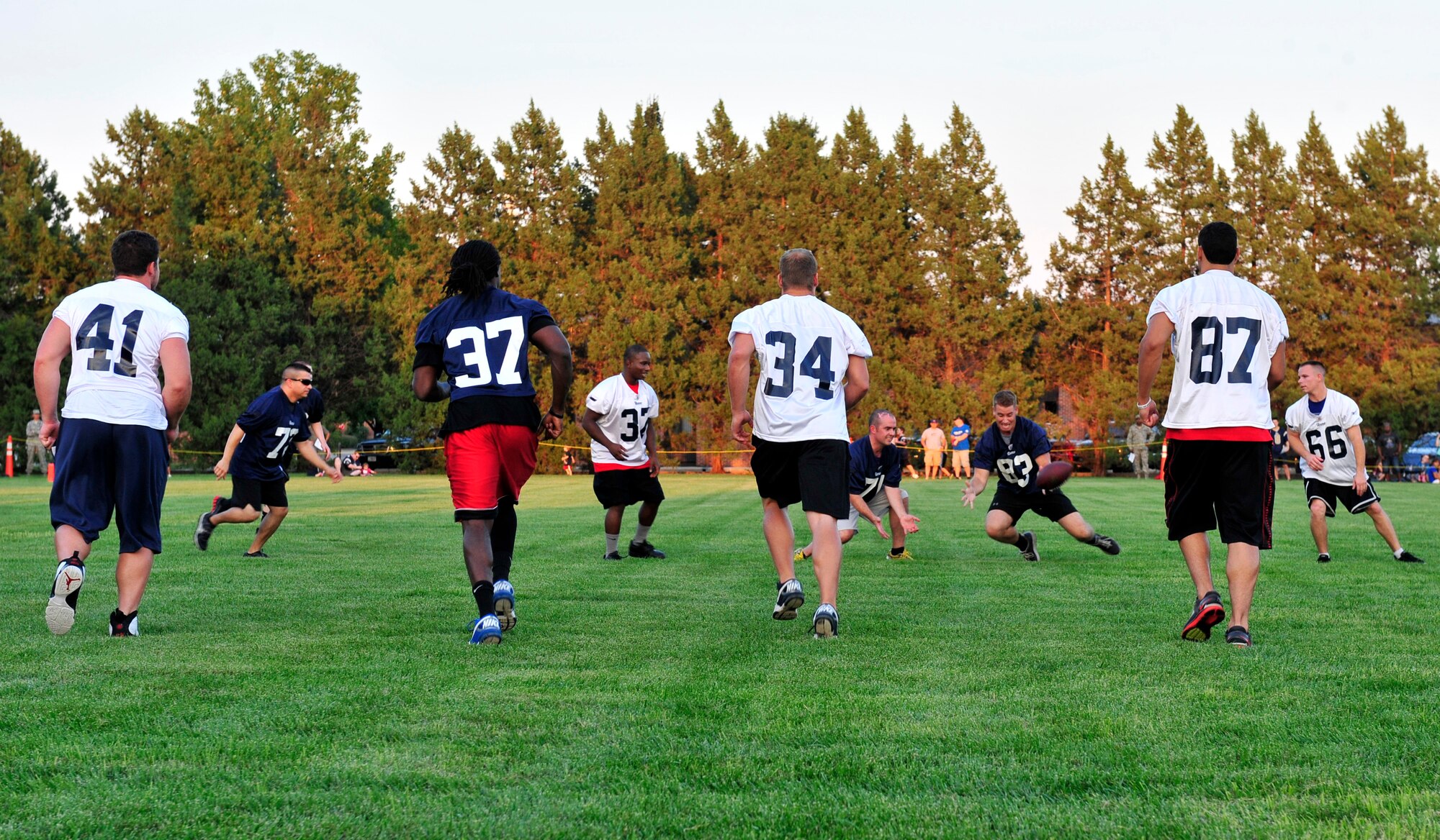 Team Scott members scrimage against the St. Louis Rams special teams unit during their visit to Scott Air Force Base, Ill., Aug. 29.  Military members received a rare opportunity to play in a practice walk through against professional football players. (U.S. Air Force photo/Staff Sgt. Stephenie Wade)