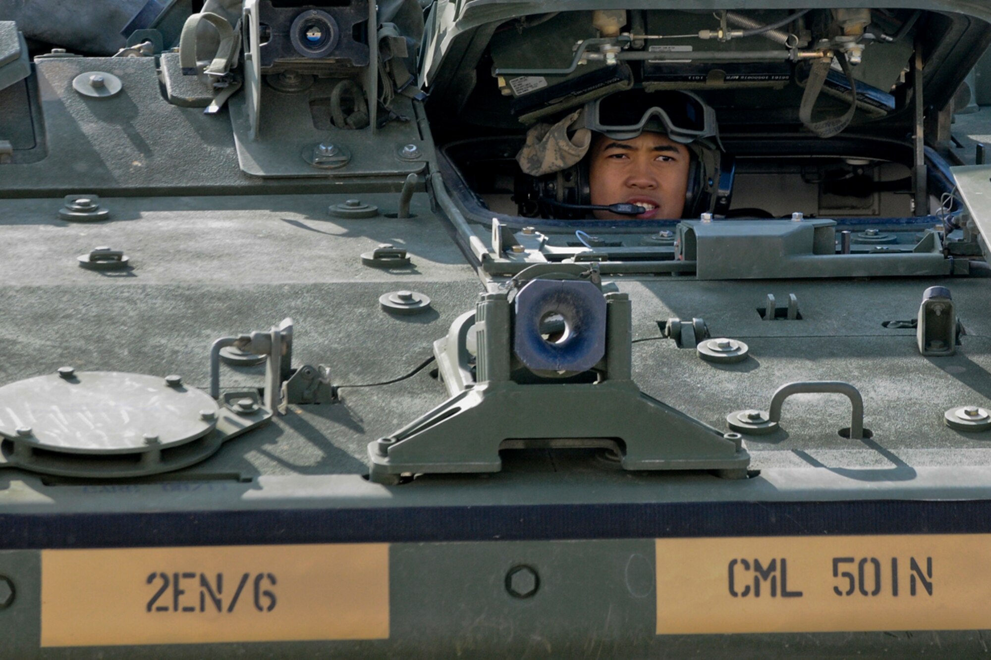 JOINT BASE ELMENDORF-RICHARDSON, Alaska -- Pfc. Seth Sevilla, 95th Chemical Company, 2nd Engineer Brigade, of Tracy, Calif., maneuvers his Stryker Nuclear, Biological, and Chemical Reconnaissance Vehicle back into the unit motor pool at JBER-Richardson, August 21, 2012.  (U.S. Air Force photo/Percy G. Jones)