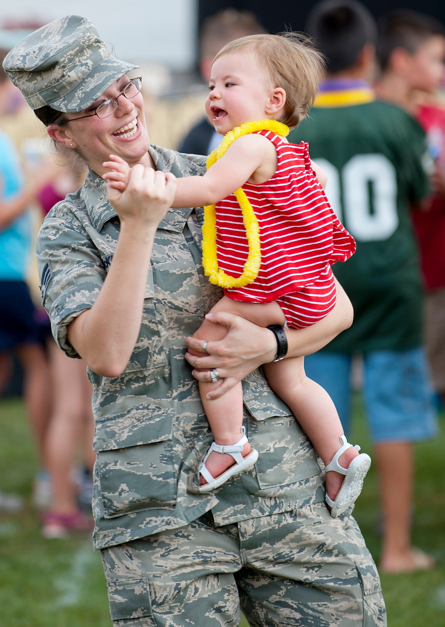 Senior Airman Katherine McKenny, 87th Aerospace Medicine Squadron medical technician, dances with her daughter, Morgan Alicia, 13 months, Aug. 24 at the Joint Base McGuire-Dix-Lakehurst Annual Summer Picnic at Doughboy Field here. McKenny hails from Smithtown, N.Y. (U.S. Air Force photo by Russ Meseroll/Released)