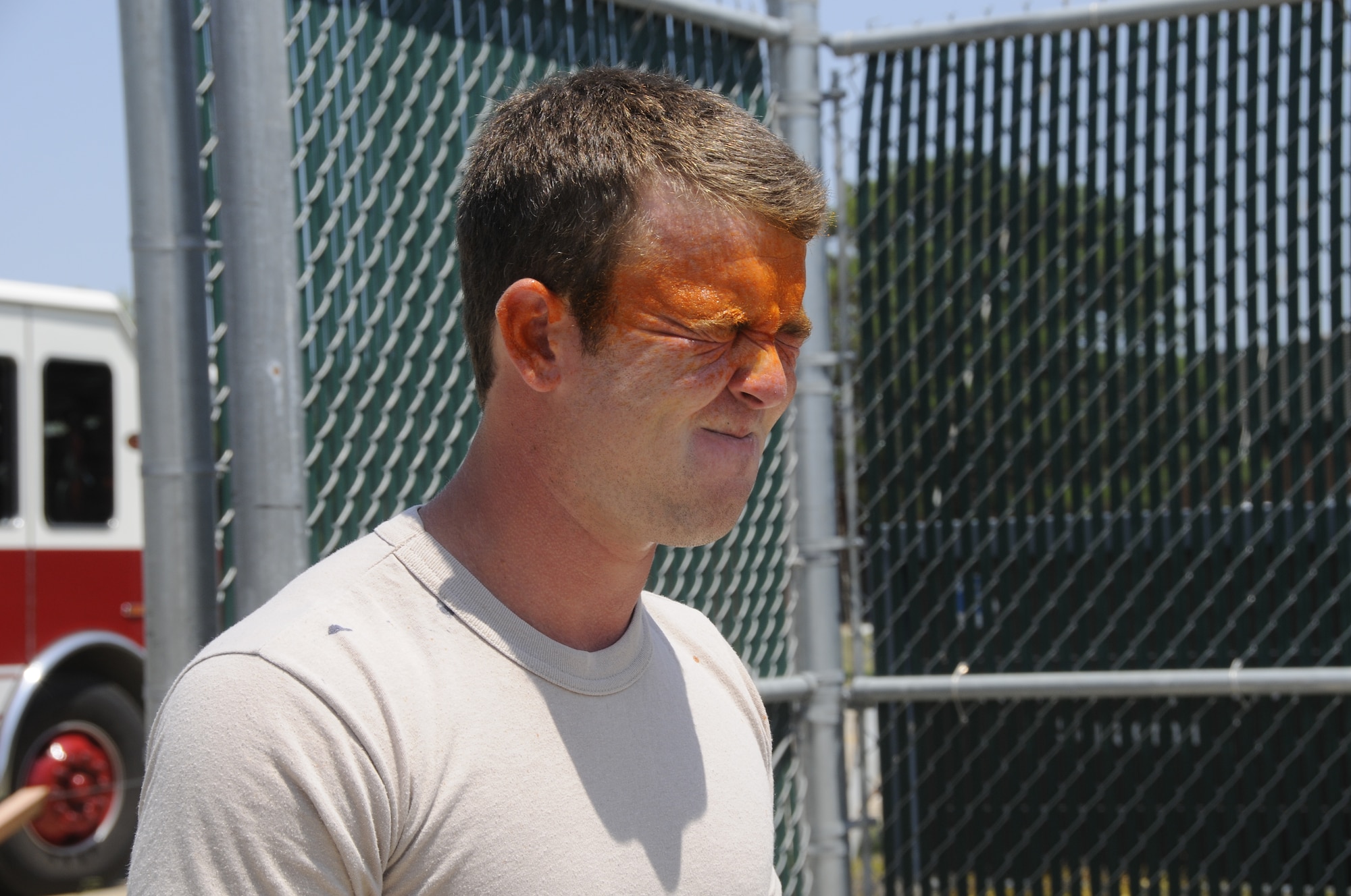 Airmen with the 188th Security Forces Squadron participated in Oleoresin Capsicum "pepper" spray training Aug. 4, 2012. Members of the SFS were pepper sprayed in the face and then had to subdue a perpetrator, which included using a baton to fend off two attackers, drawing their service weapon and conducting handcuffing procedures. (National Guard photo by Airman 1st Class Hannah Landeros/188th Fighter Wing Public Affairs)

