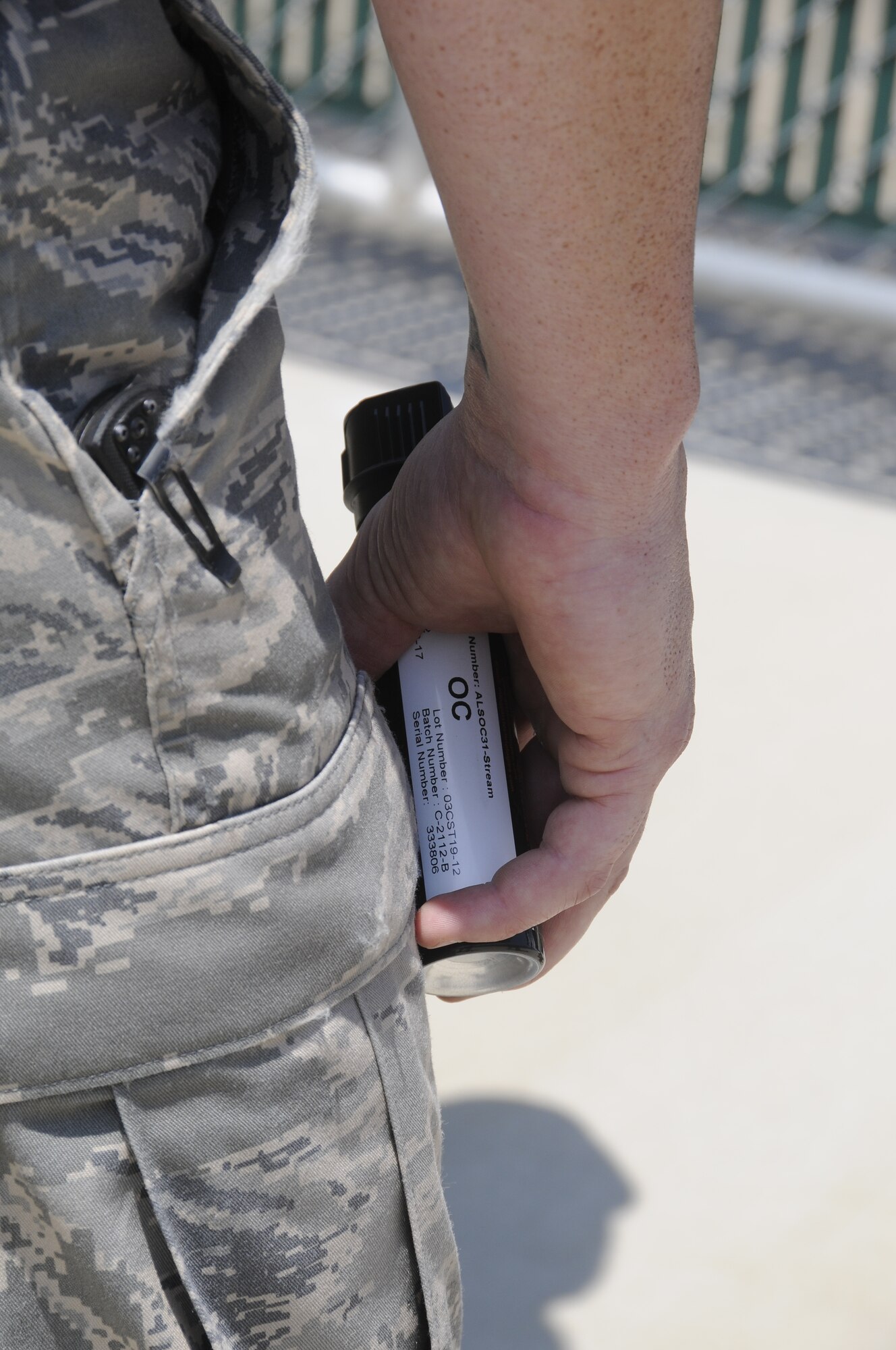 Airmen with the 188th Security Forces Squadron participated in Oleoresin Capsicum "pepper" spray training Aug. 4, 2012. Members of the SFS were pepper sprayed in the face and then had to subdue a perpetrator, which included using a baton to fend off two attackers, drawing their service weapon and conducting handcuffing procedures. (National Guard photo by Airman 1st Class Hannah Landeros/188th Fighter Wing Public Affairs)

