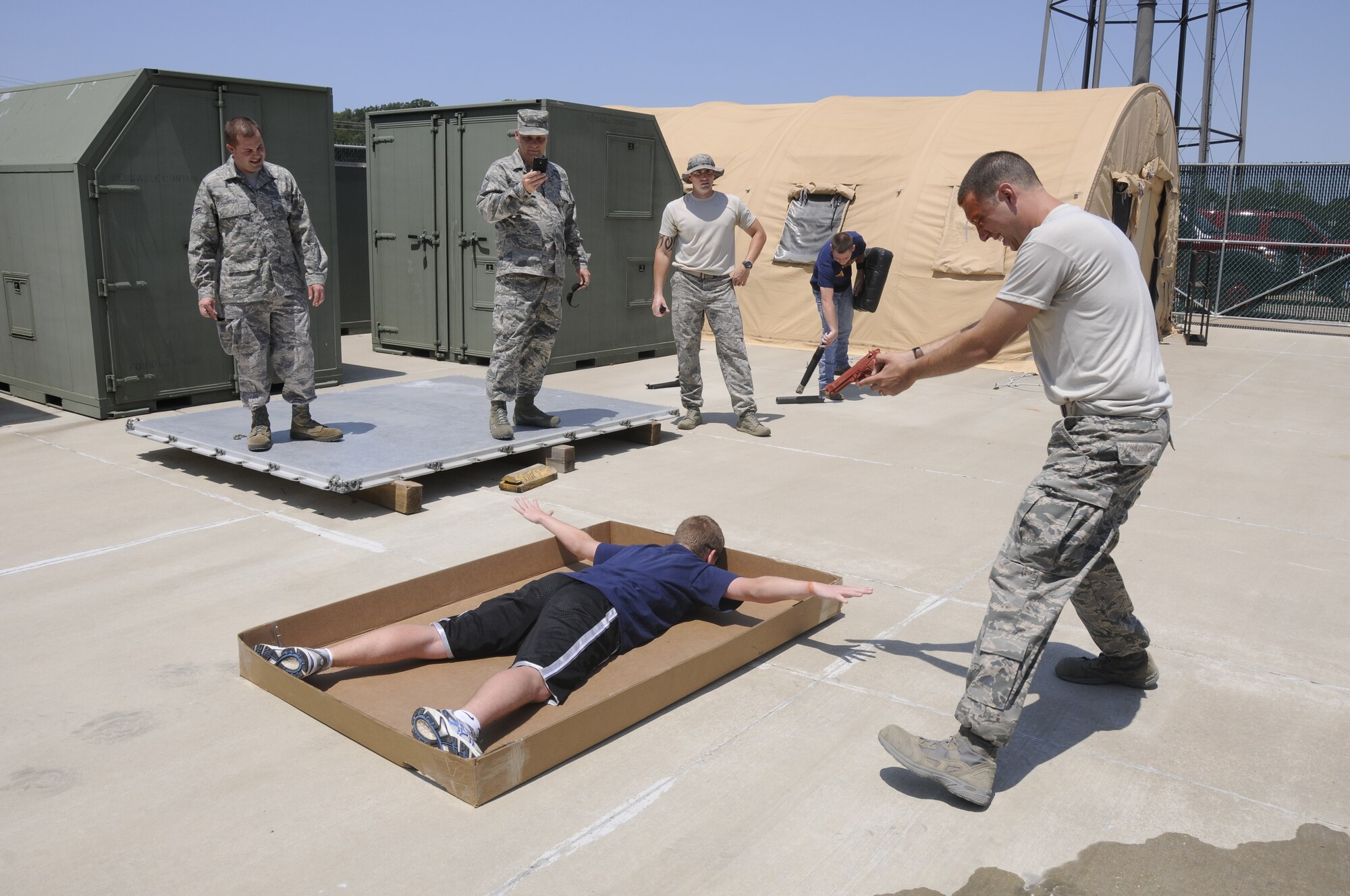 Airmen with the 188th Security Forces Squadron participated in Oleoresin Capsicum "pepper" spray training Aug. 4, 2012. Members of the SFS were pepper sprayed in the face and then had to subdue a perpetrator, which included using a baton to fend off two attackers, drawing their service weapon and conducting handcuffing procedures. (National Guard photo by Airman 1st Class Hannah Landeros/188th Fighter Wing Public Affairs)

