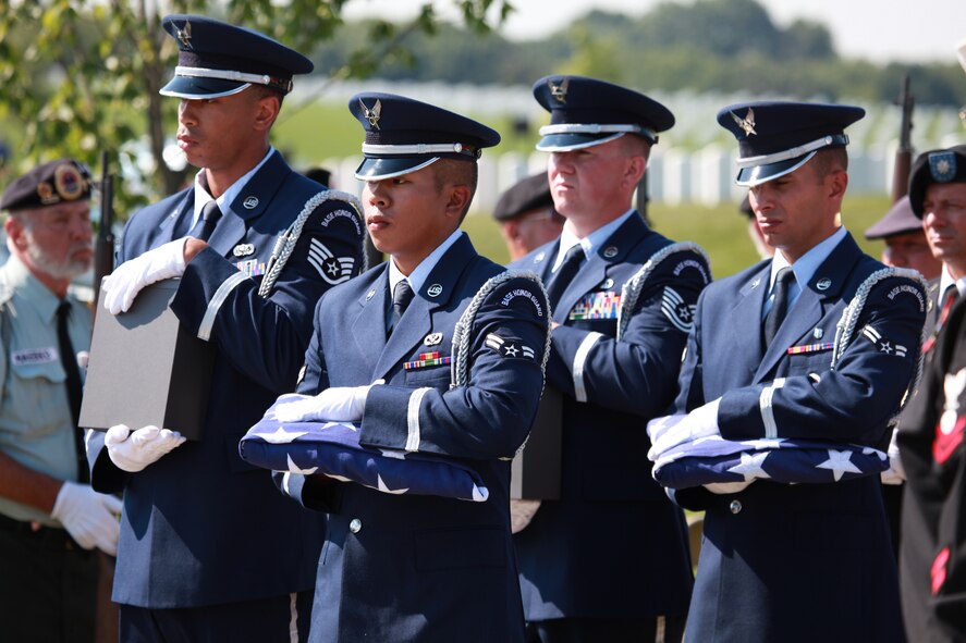 A 911th Airlift Wing Base Honor Guard Airman carries the remains of a fallen soldier during a military burial held at the National Cemetery of the Alleghenies in Cecil Township, Pa, Aug. 23, 2012. The remains of 15 veterans came home at last at the Western Pennsylvania national cemetery after the hard work of area veterans, funeral directors and the Missing In America Project. The MIAP’s primary mission is to locate, identify and inter the unclaimed cremated remains of American veterans through the joint efforts of private, state and federal organizations. (U.S. Photo by Tech. Sgt. Ralph Van Houtem/Released)