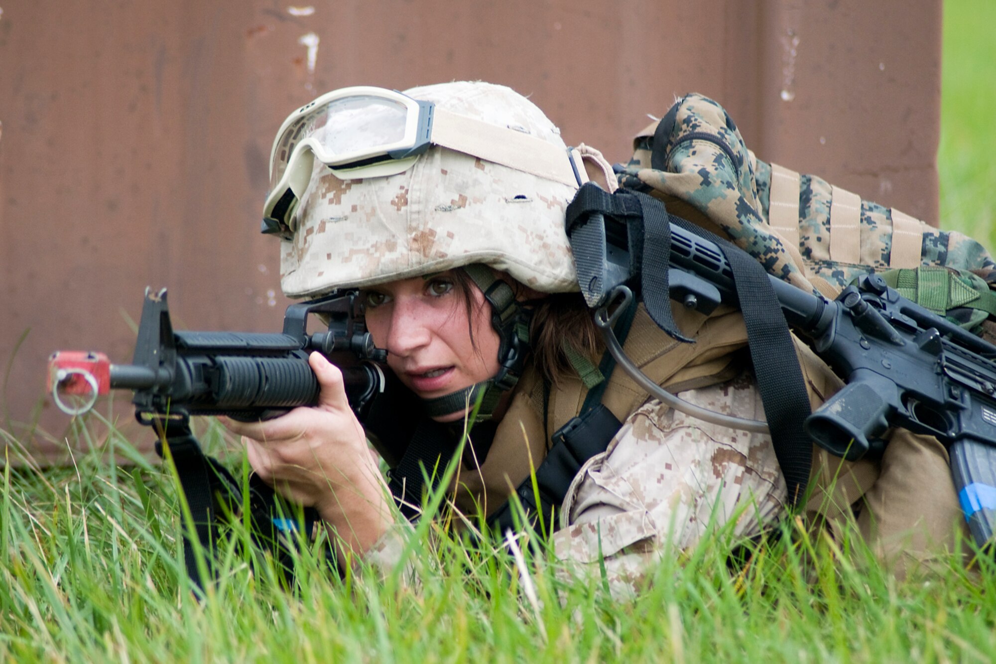 GRISSOM AIR RESERVE BASE, Ind. -- U.S. Marine Corps Reserve Lance Cpl. Rachel Hastin takes up a defensive fighting position during a joint forces exercise Aug. 5. Hastin is assigned to Detachment 1, Communications Company, Headquarters and Service Battalion, 4th Marine Logistics Group here. (U.S. Air Force photo/Tech. Sgt. Mark R. W. Orders-Woempner)
