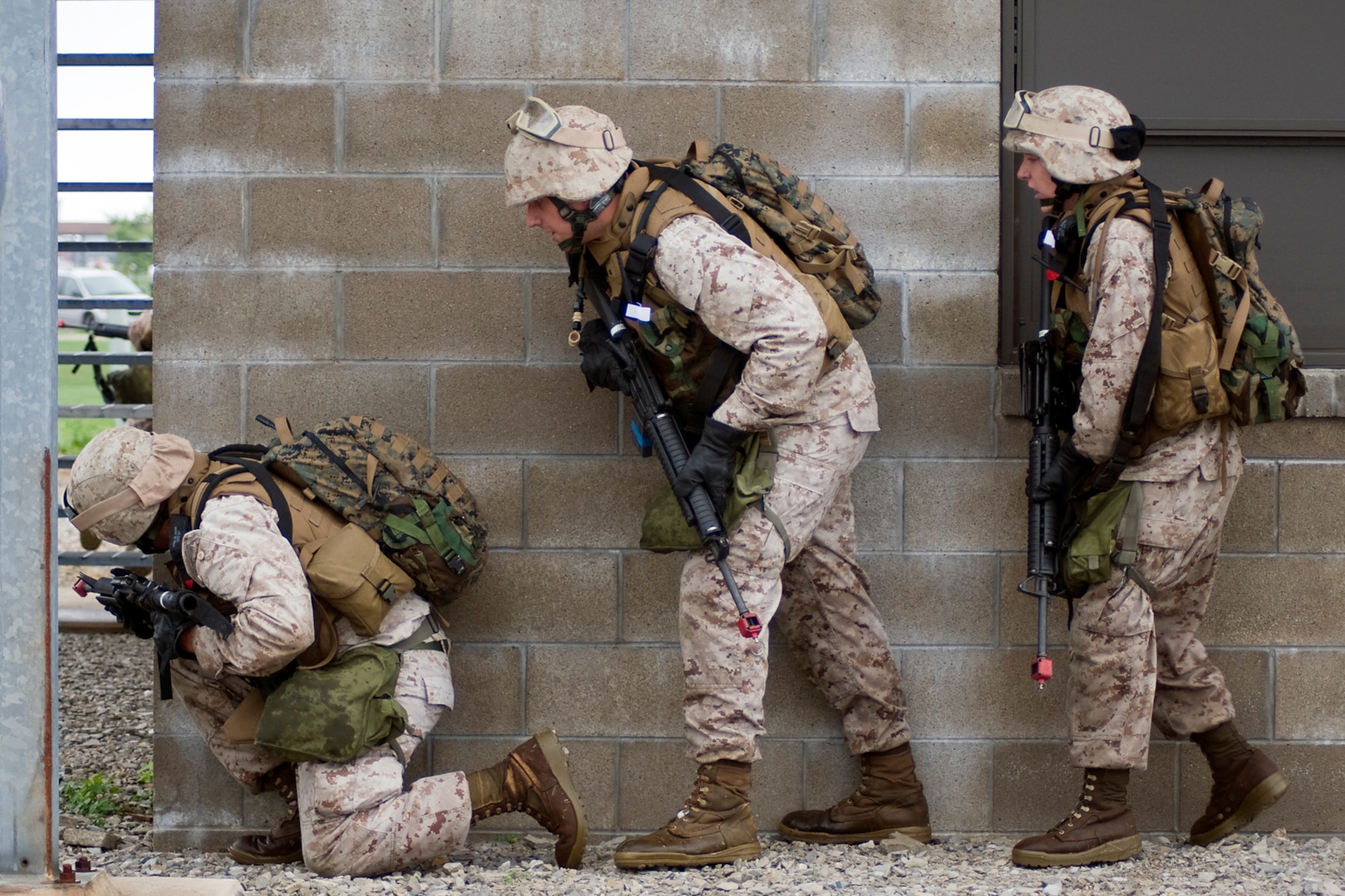 GRISSOM AIR RESERVE BASE, Ind. -- U.S. Marine Corps reservists from  Detachment 1, Communications Company, Headquarters and Service Battalion, 4th Marine Logistics Group here prepare to clear a facility where a simulated terrorist is holed up during a joint forces exercise here Aug. 5. Grissom's Air Force Reserve, Army Reserve and Marine Reserve units all participated in the exercise aimed at providing invaluable training for life-or-death scenarios. (U.S. Air Force photo/Tech. Sgt. Mark R. W. Orders-Woempner)
