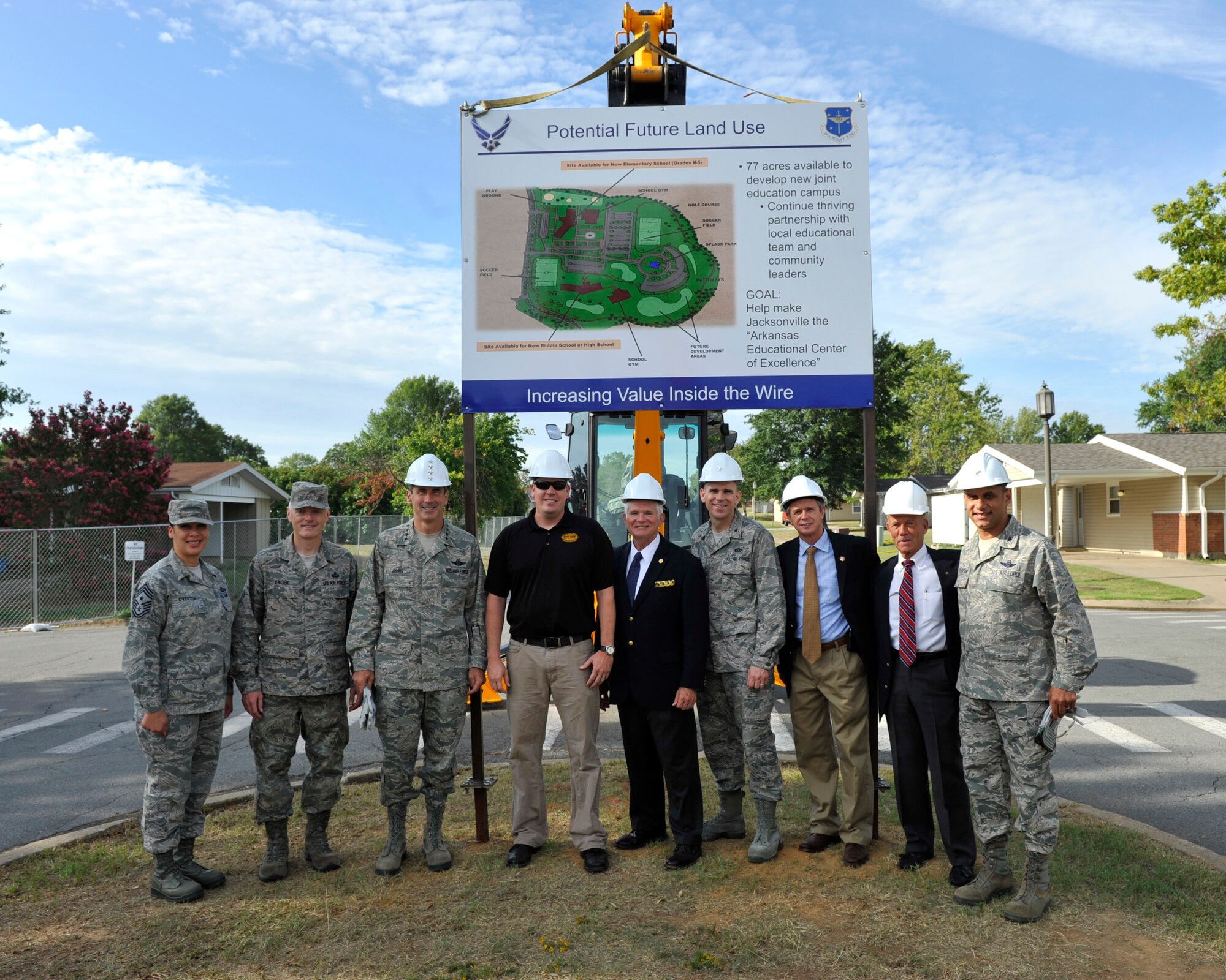 Gen. Raymond Johns, Air Mobility Command commander, Brig. Gen. Timothy Green, AMC director of installations and mission support, Col. Brian Robinson, 19th Airlift Wing commander, Chief Master Sgt.  Andy Kaiser, AMC command chief, Chief Master Sgt. Margarita Overton, 19th AW command chief, and local civic leaders gathered at Little Rock Air Force Base, Ark., for the “77 Acres” project in base housing Aug. 30, 2012.  The “77 Acres” are planned to be available as early as spring of 2013 to develop new joint education campus, with the base offering low-cost land leases to incentivize expedited construction. (U.S. Air Force photo/Airman 1st Class Rusty Frank)