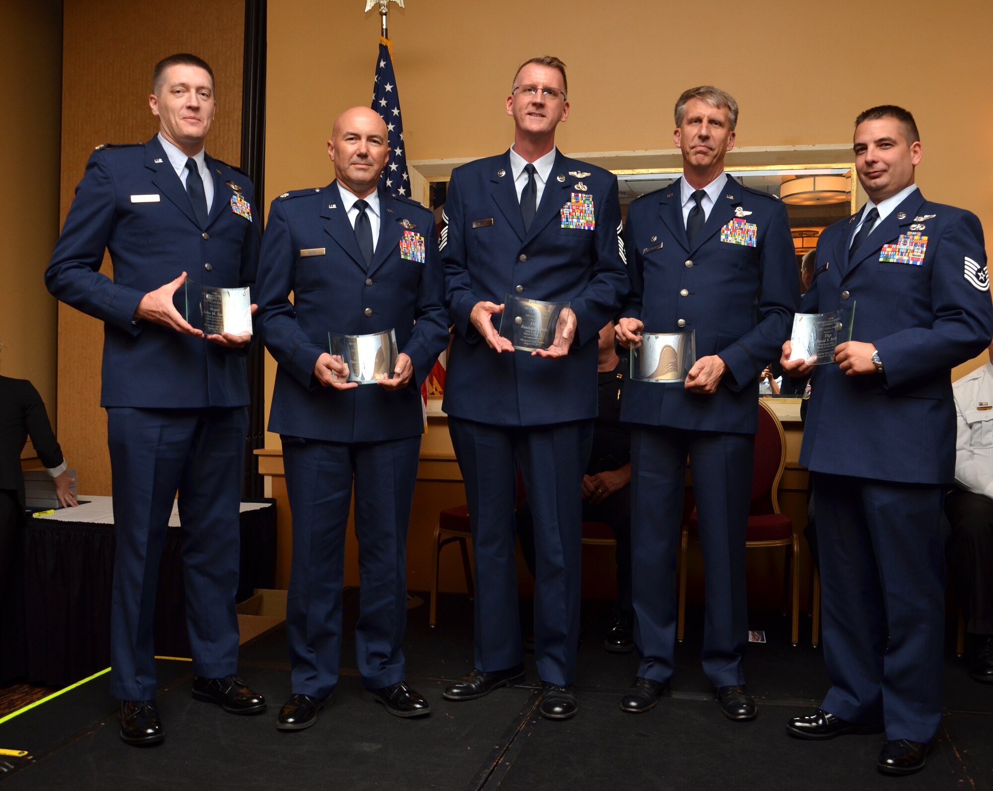 Rescue Airmen from the 920th Rescue Wing, Patrick Air Force Base, Fla., receive a Life Saving Award Aug. 30, for the February 2012 rescue of four men on an air boat. From left to right: Maj. John Tatton, Lt. Col. Timothy Davis, Senior Master Sgt. Randolph Wells, Col. Jeffrey Macrander and Tech. Sgt David Y. Bahr. (U.S. Air Force photo/Senior Airman Natasha Dowridge)