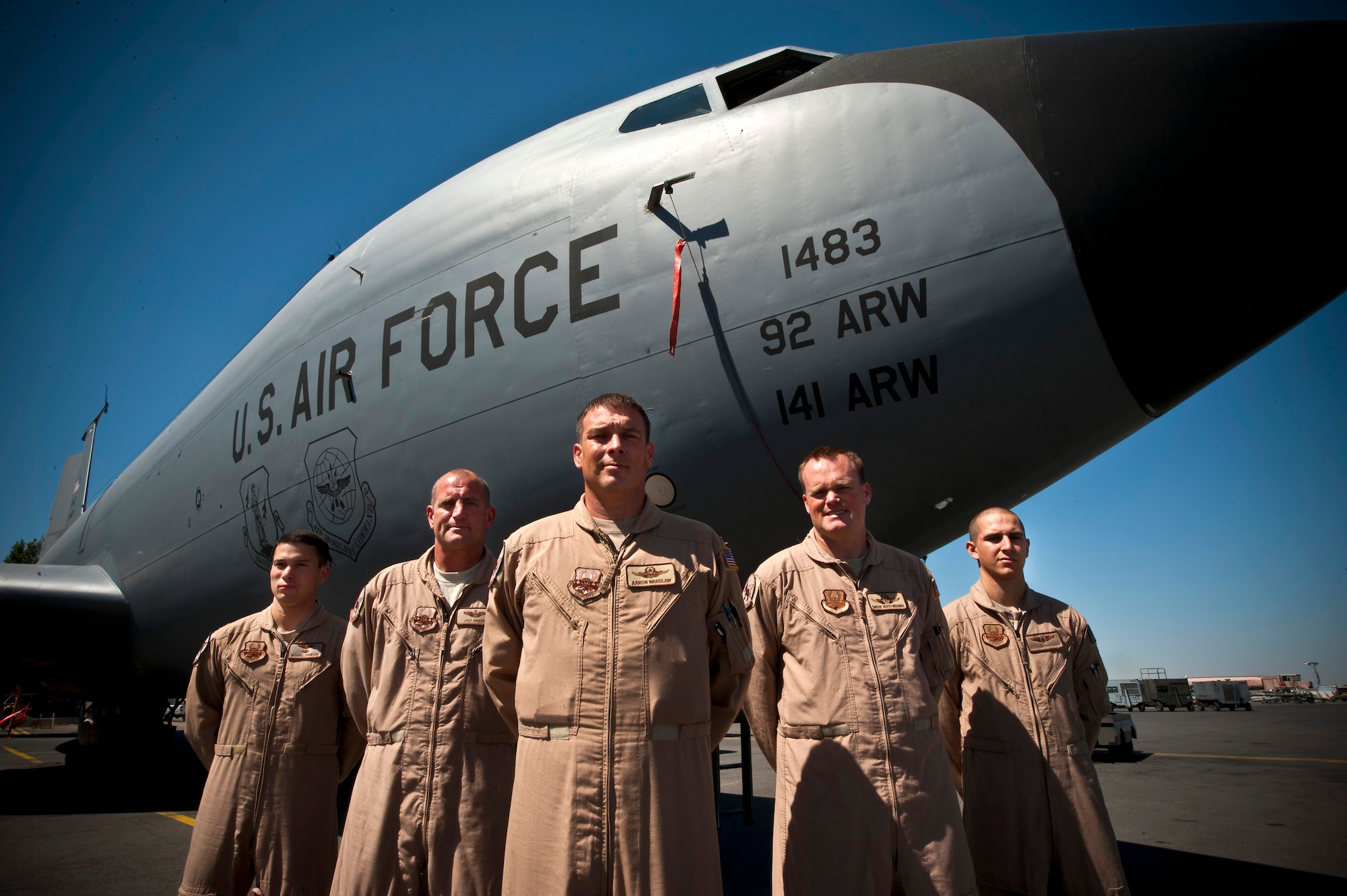 Left to right, Capt. Michael Thomson, Maj. Jody Griffin, Lt Col. Aaron Wardlaw, Senior Master Sgt. Keith Werner and Airman 1st Class Frank Pappalardo stand in front of a KC-135 Stratotanker at the Transit Center at Manas, Kyrgyzstan, Aug. 31, 2012. The 22nd Expeditionary Air Refueling Squadron KC-135 crew assisted stricken fighter aircraft by guiding it through a series of specific maneuvers to reset the on-board flight computers and allowing the pilot to regain effective communcations and navigational instruments. (U.S. Air Force photo/Senior Airman Brett Clashman)