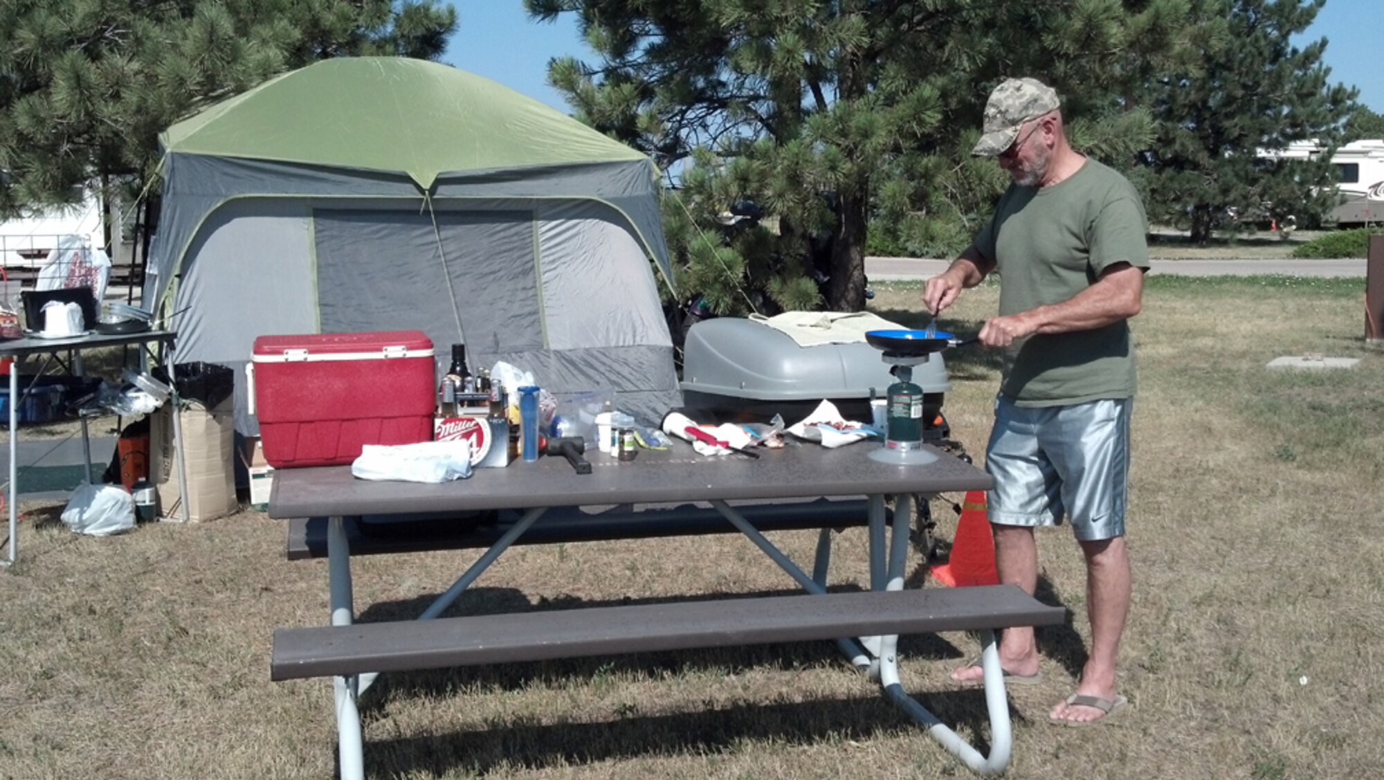 Chief Master Sgt. (ret.) Benjamin Lopedote cooks up breakfast while camping at the Ellsworth Air Force Base Family Camp. (USAF photo by MSgt. Wendy Lopedote, 916ARW/PA)