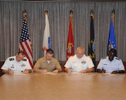 Senior leaders from each of the military services in San Antonio kickoff the 2012 Combined Federal Campaign during a signing ceremony Aug. 27 at JBSA-Randolph.  From left are: Army Maj Gen Walter L. Davis,, United States Army North deputy commanding general; Marine Maj Martin D. Gale, Inspector-Instructor Staff executive officer, Navy Capt. John D. Larnerd Jr., Navy Medicine Training Center commanding officer; and Air Force Gen. Edward A. Rice Jr., Air Education and Training Command commander.  The 2012 CFC begins Sept. 1st. (U.S. Air Force photo by Richard McFadden)