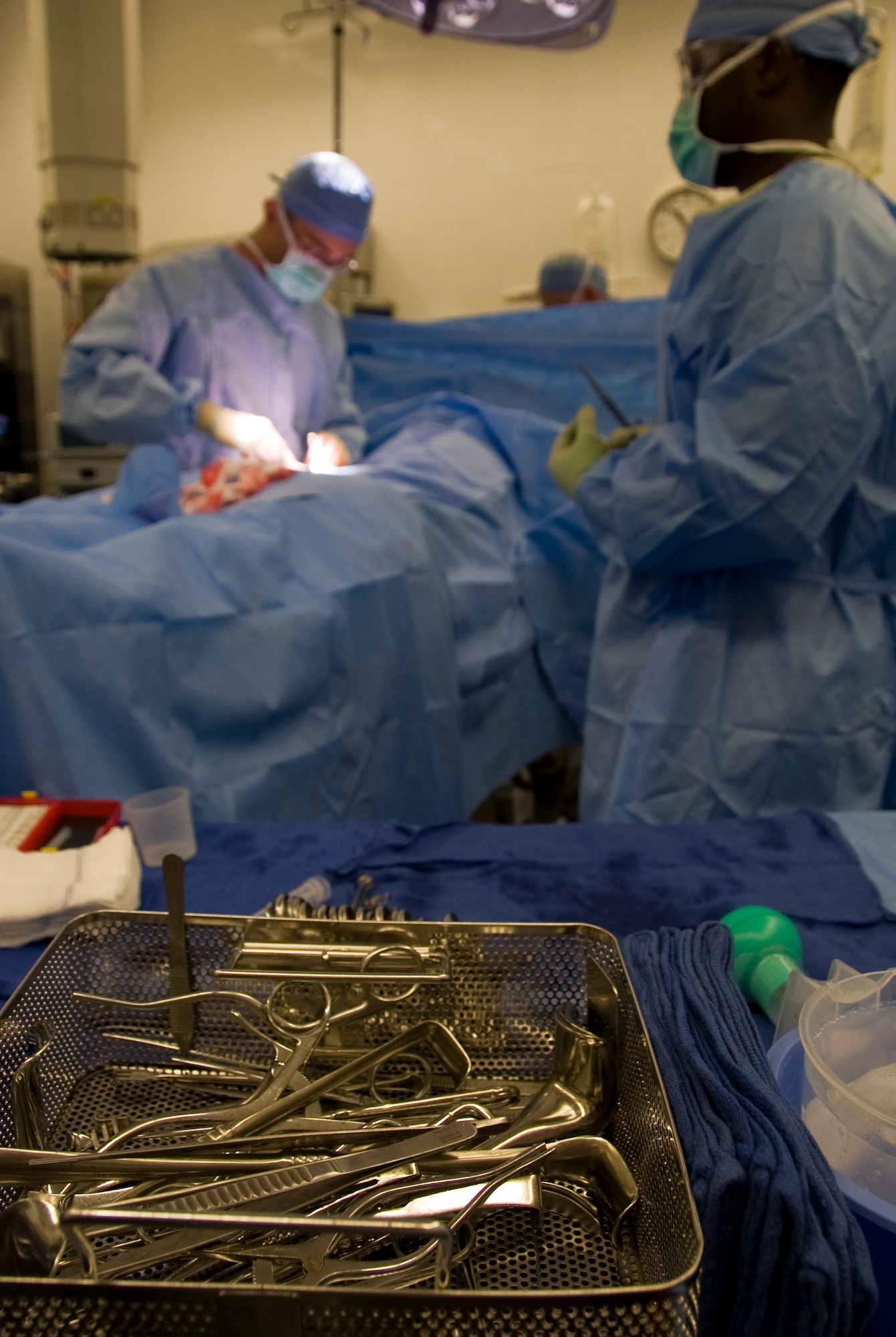 Members of the 379th Expeditionary Medical Group perform a hernia surgery in Southwest Asia, August, 17, 2012. The 379th surgical team provides surgical support for the entire area of responsibility. (U.S. Air Force photo/Staff Sgt. Sheila deVera)