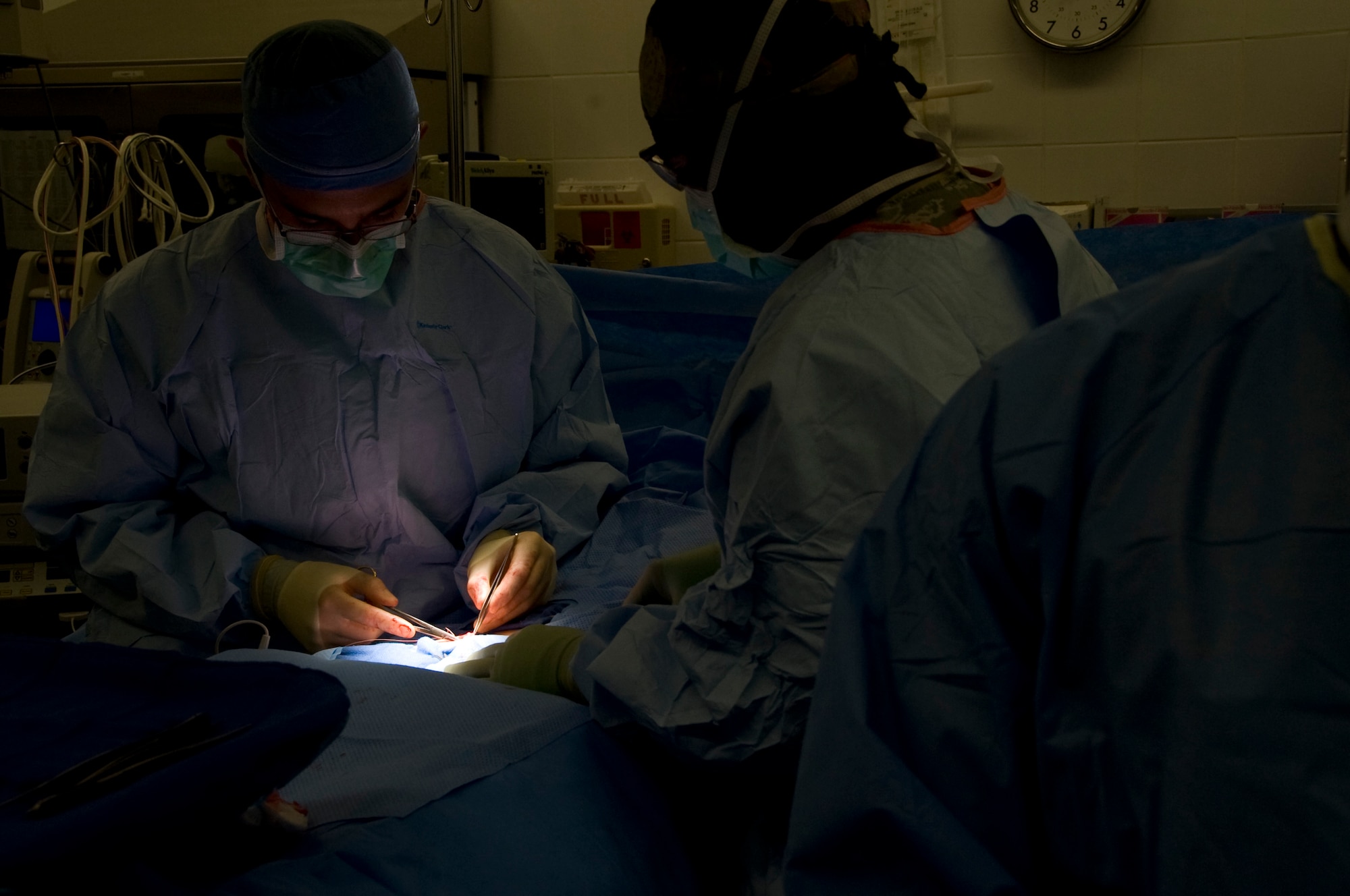 U.S. Air Force Major Noris Jackson assists General Surgeon Maj. Thomas Ziolkowski with a hernia surgery in Southwest Asia, August 17, 2012. The 379th surgical team provides surgical support for the entire area of responsibility. Jackson and Ziolkowski are both assigned to the 379th Expeditionary Medical Group. (U. S. Air Force photo/Staff Sgt. Sheila deVera)