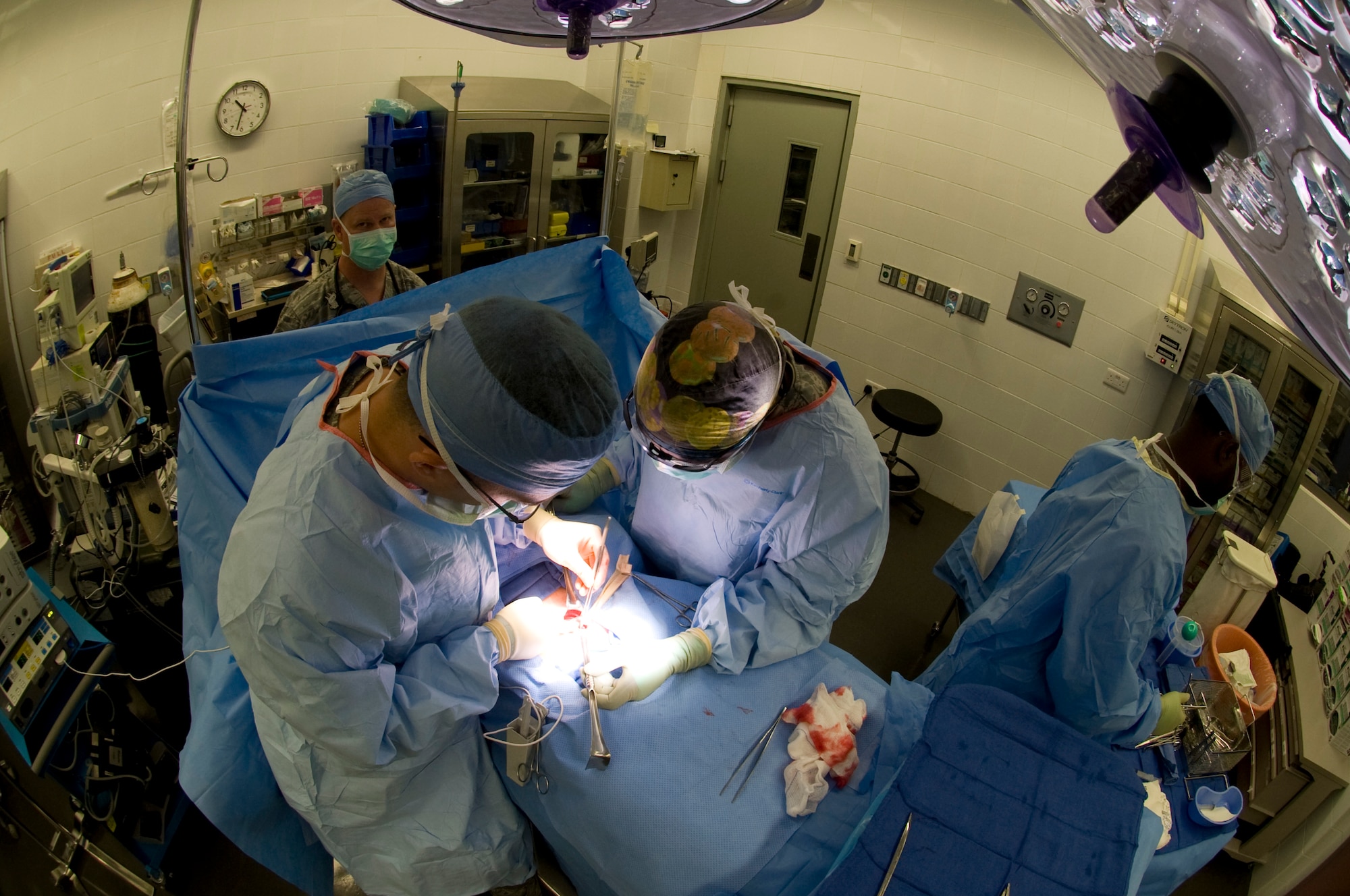 Members of the 379th Expeditionary Medical Group perform a hernia surgery in Southwest Asia, August, 17, 2012. The 379th surgical team provides surgical support for the entire area of responsibility. (U.S. Air Force photo/Staff Sgt. Sheila deVera)