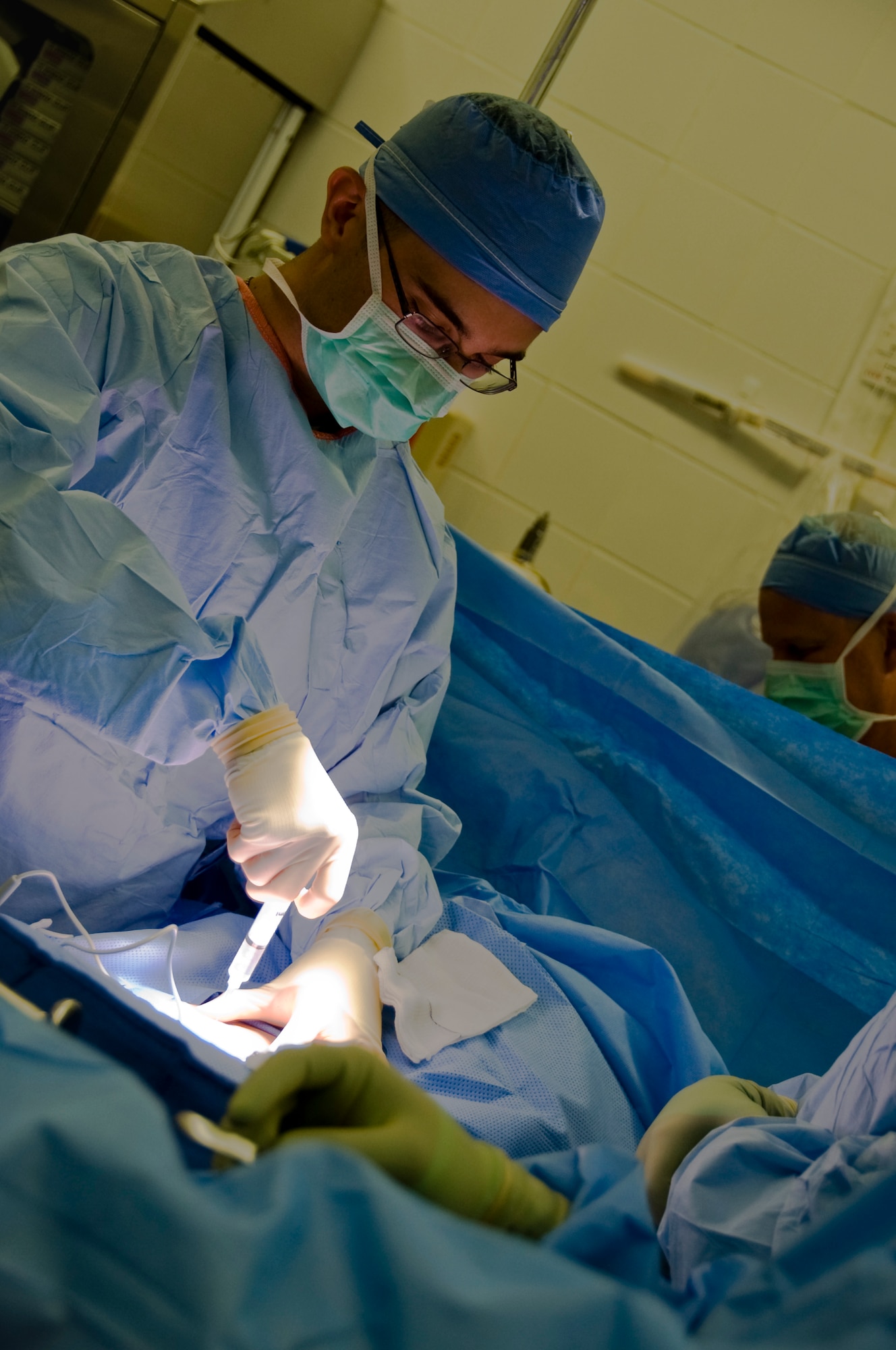 U.S. Air Force Major Thomas Ziolkowski, 379th Expeditionary Medical Group general surgeon, performs a hernia surgery in Southwest Asia, August 17, 2012. The 379th surgical team provides surgical support for the entire area of responsibility. (U.S. Air Force photo/Staff Sgt. Sheila deVera)