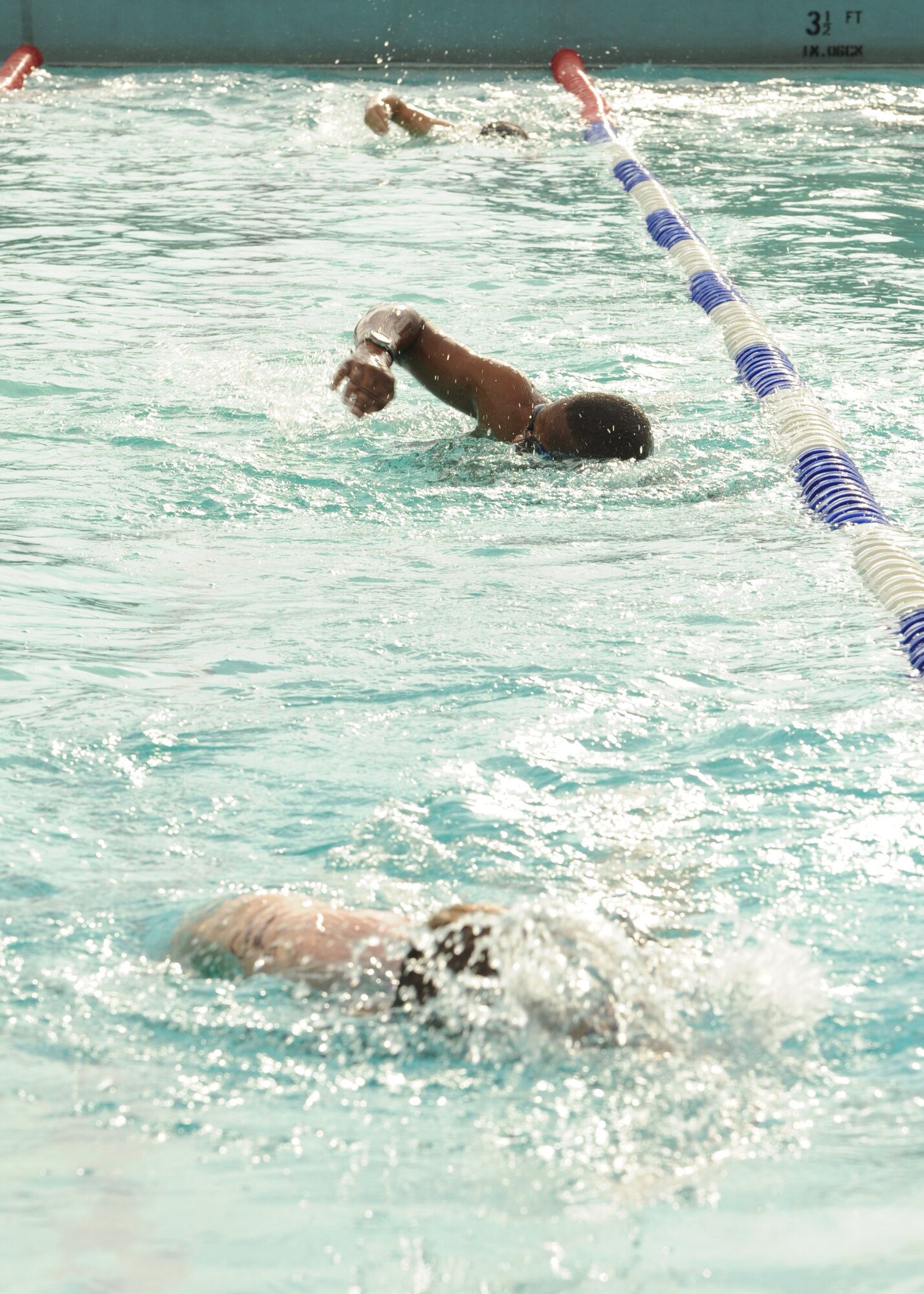 Members of the 8th Fighter Wing swim during a triathlon on  Kunsan Air Base, Republic of Korea, Aug. 25. This was the second triathlon this year and had more than 25 participants (U.S. Air Force photo/Staff Sgt. Jonathan Fowler)