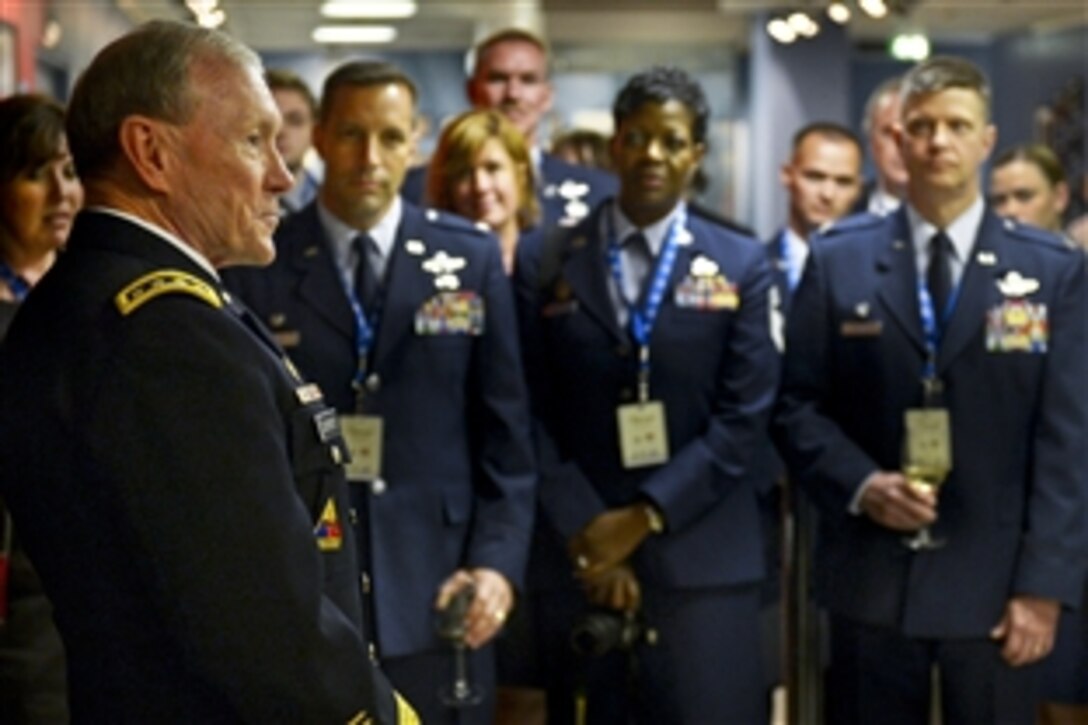 U.S. Army Gen. Martin E. Dempsey, chairman of the Joint Chiefs of Staff, addresses service members volunteering at the 2012 Paraiylmpic Games in London, England, Aug. 30, 2012. 