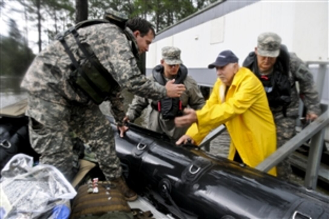 Soldiers search through flooded areas in Moss Point, Miss., for stranded residents following Isaac, which has been downgraded to a tropical depression, Aug. 30, 2012. The soldiers, assigned to Support Company, 2nd Battalion, 20th Special Forces Group, and other Mississippi National Guardsmen have rescued more than 350 individuals over the past fewdays in Jackson, Hancock, and Harrison counties along the Gulf Coast.