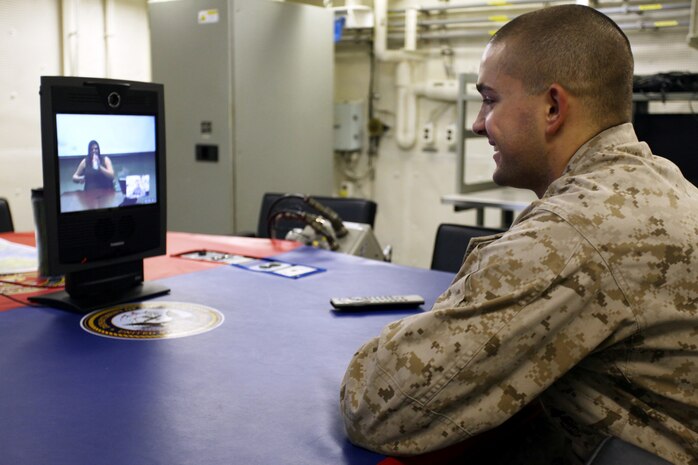 Marines and Sailors of the 24th Marine Expeditionary Unit aboard the USS New York contacted their family through a video teleconference system, Aug. 25, 2012, to meet their new babies and talk to their pregnant wives.