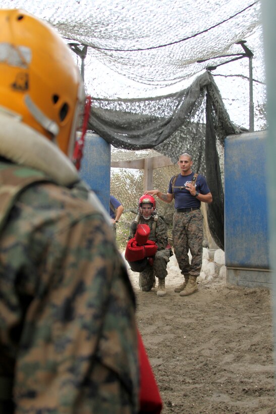 Recruits of Co. I, 3rd Recruit Training Battalion, are prepped by their drill instructors before competing against one another in a pugil stick fight aboard Marine Corps Recruit Depot San Diego Aug. 21. The winners of each platoon were tallied and the platoon with the most wins earned a pugil stick trophy. 