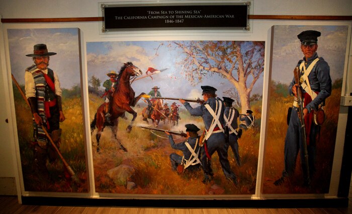 An open house was help at the Command Museum aboard Marine Corps Recruit Depot San Diego Aug. 28 for a mural painted by Cpl. Jesse Alwin, reproduction specialist, Service Company, Headquarters and Service Company. California Campaign: La Ultima Resistancia (The Last Stand) depicts a battle scene during the Mexican-American War. The museum was looking to add a piece to focus on the war and provided Alwin with all the historical information on the Marines and local Californians of that period and took up to six weeks to complete. Joanie Schwarz-Wetter, education specialist at the Command Museum, explained the mural is beneficial to the exhibit decicated to the time period because certain grades study the Mexican-American War and will help students understand California's role during the war. The piece can be viewed at the museum during hours of operation. Alwin explains that the piece has been up for about a week and it's been getting positive reactions. "It was a great experience," said Alwin. "All the museum personnel have been very helpful."