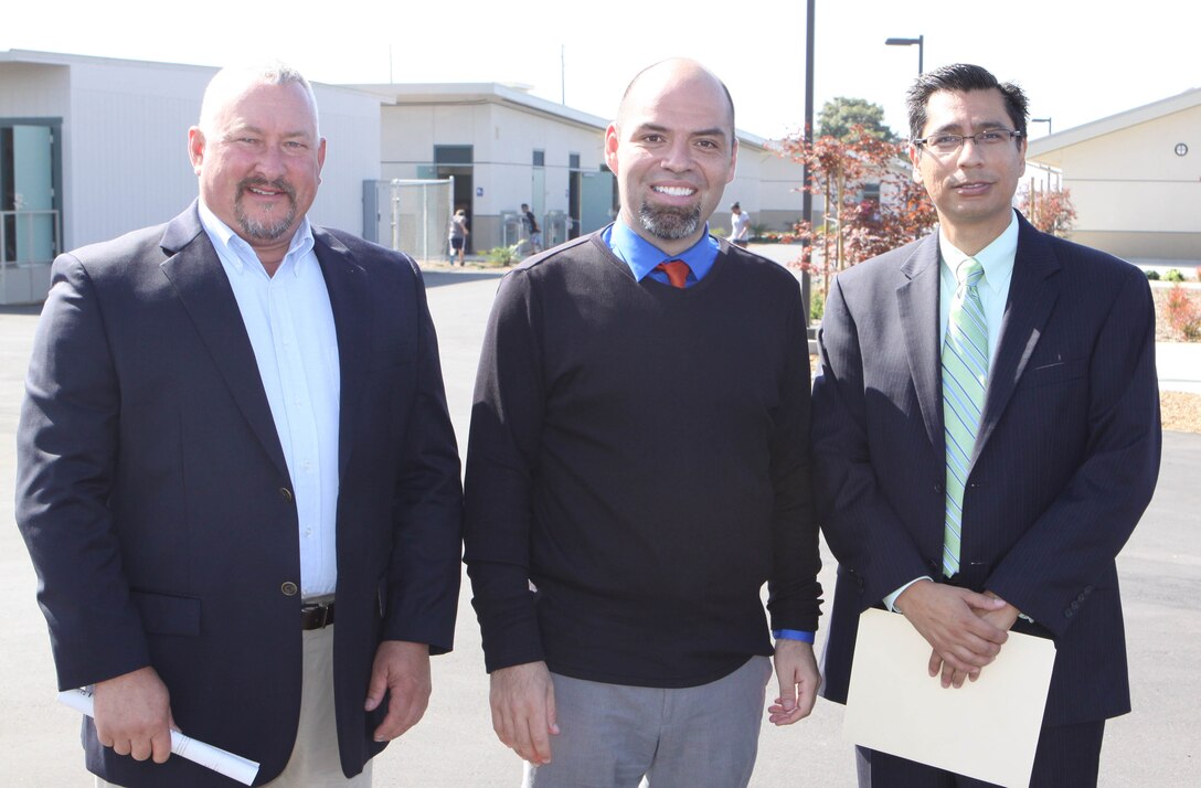 Fausto Barragan (center), the principal of North Terrace Elementary here, poses with Dr. Luis Ibarra (right), the Superintendent of Business at the Oceanside Unified School District, and Terry Jones (left), director of project instruction and management with Arcadis U.S., at the school's grand re-opening ceremony on their new and improved campus, Aug. 31. North Terrace re-opened its doors to more than 900 students after being closed for renovations for more than a year. Students and faculty attended nearby Ditmar Elementary School during renovations. Upgrades to the school include new administration and kindergarten buildings, as well as a redirected entrance.