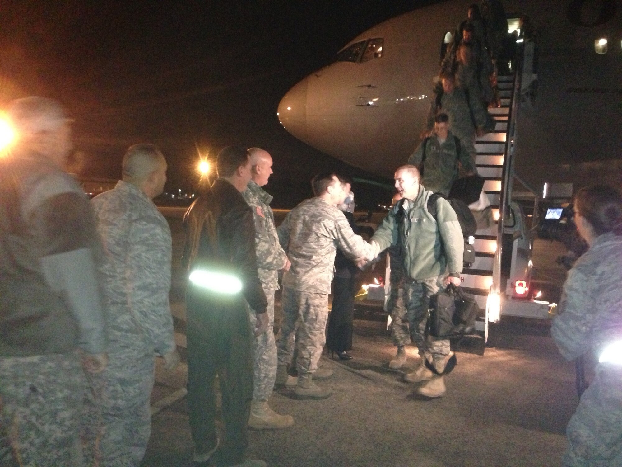 Lt. Col. William Neri, commander, 103rd Air Control Squadron, receives a warm handshake welcome during a homecoming for deployed Airmen at Bradley Air National Guard base, East Granby, Conn., Nov. 20, 2012. The Airmen completed a six-month tour of duty in Southwest Asia and returned home just in time for Thanksgiving. (U.S. Air Force photo by Capt. Jefferson S. Heiland)