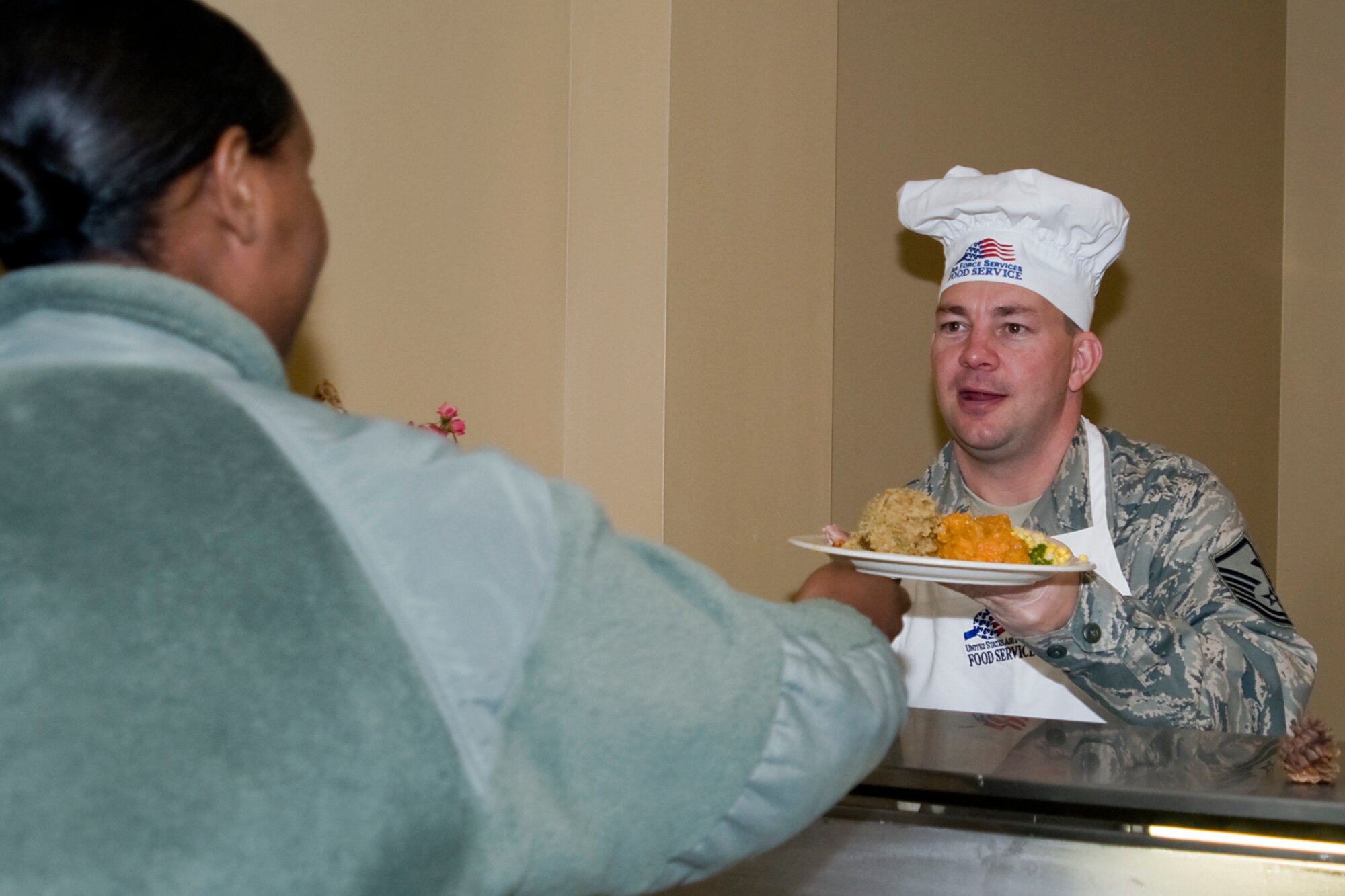 GRISSOM AIR RESERVE BASE, Ind. --  Master Sgt.  Brian Rudd, 434th Logistics Readiness Squadron first sergeant, serves a special holiday meal. Senior leadership from the 434th Air Refueling Wing rolled up their sleeves to serve a special holiday meal and greet Airmen during a recent Unit Training Assembly.   (U.S. Air Force photo/Senior Airman Jami K. Lancette)