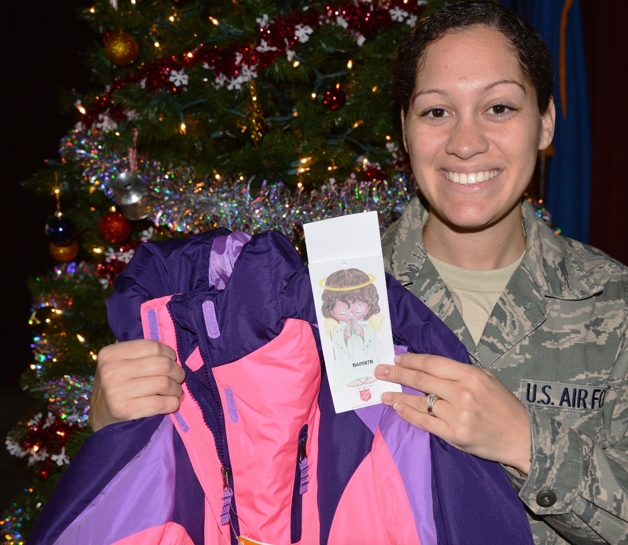 Tech. Sgt. Ashley Mooney, functional systems manager with the 175th Logistics Readiness Squadron, stands with one of many gifts for the Angel Tree. Maryland Air National Guard members contributed to a Salvation Army program to help less fortunate families. (National Guard photo by Tech. Sgt. David Speicher)