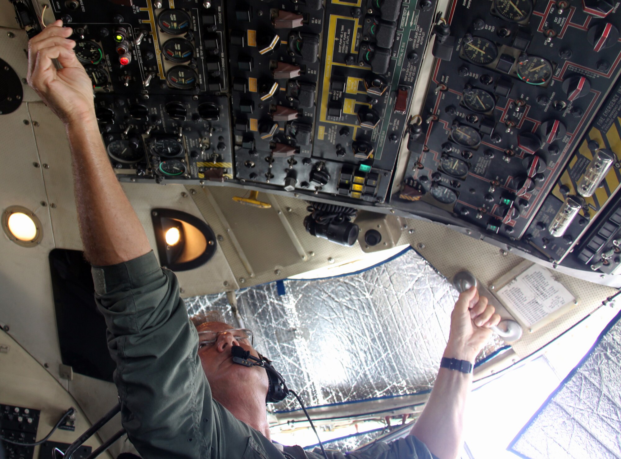 Master Sgt. Dan Ruedisueli, a 758th Airlift Squadron Aircraft flight engineer, makes the long reach to perform a bleed air check during a preflight inspection, April 9, 2012.  Approximately 50 unit members from the 911th Airlift Wing arrived in Puerto Rico on March 31, 2012, to support Coronet Oak missions flying throughout the U.S. Southern Command area of responsibility.  (U.S. Air Force photo by Capt. Shawn M. Walleck/Released)