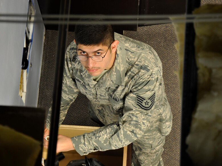 MCCHORD FIELD, Wash. - Tech. Sgt. Lazare Quintana, 446th CES utilities system assistant here, installs a water supply line inside building 1216, Dec. 2.  Quintana was selected by the 313th Airlift Squadron for a position as a C-17 Globemaster III pilot.  The Reservist is planning to turn in his plumbing tools and head to Officer Training School in March 2013, then onto Flight School.  (U.S. Air Force photo by 2nd Lt. Lori Fiorello)