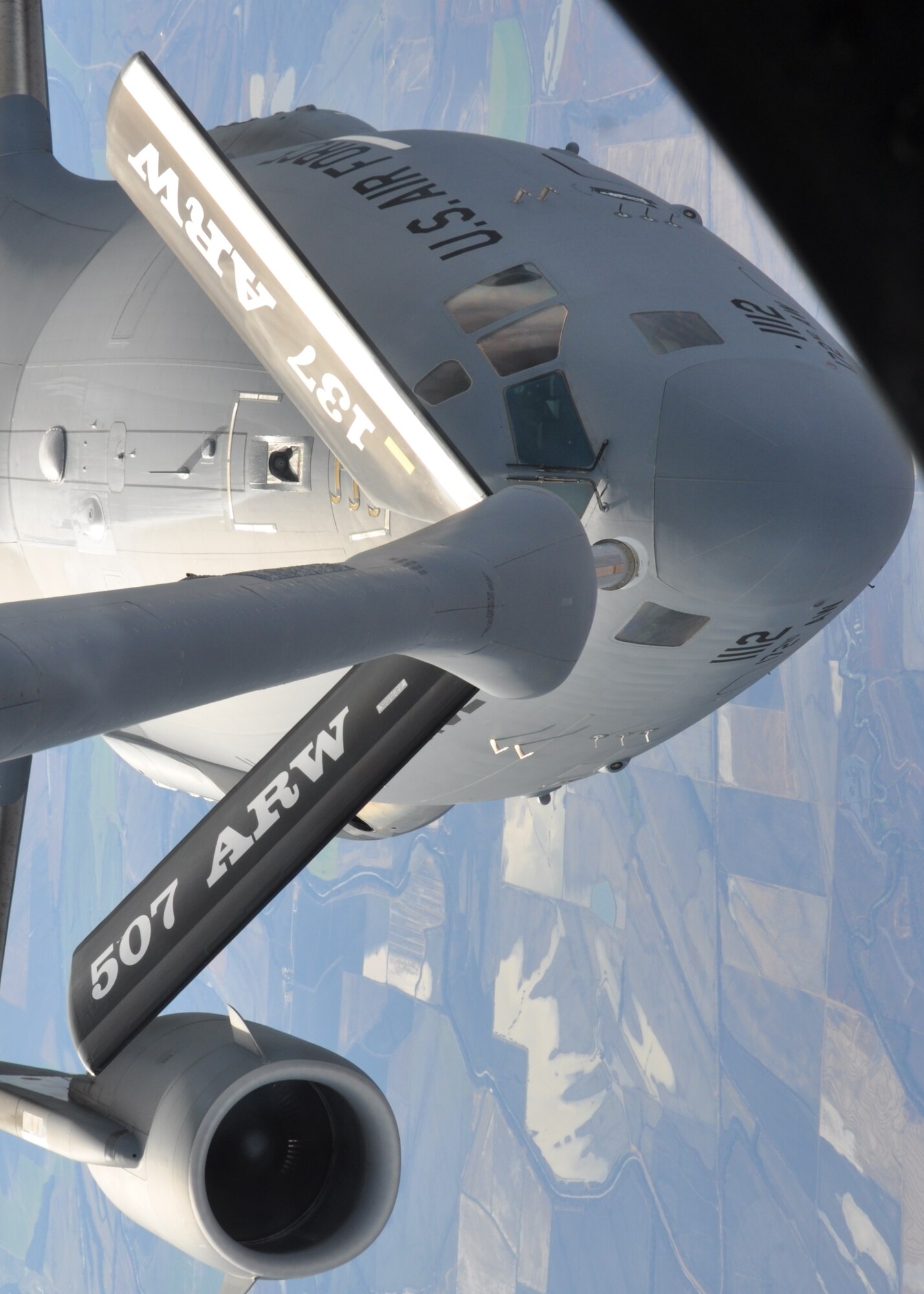 A 465th Air Refueling Squadron crew refuels a Mississippi Air National Guard C-17 Globemaster from the 172nd Airlift Wing over the skies of Louisiana on November 29. The 465th ARS crew conducted over 45 minutes of refueling with the Mississippi ANG unit. (Photo by Capt. Jon Quinlan)