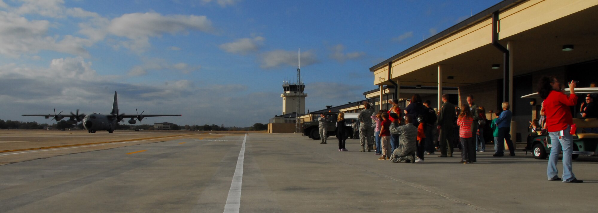 The 53rd Weather Reconnaissance Squadron WC-130J arrives with Santa Claus on board at the Roberts Maintenance Facility at Keesler Air Force Base, Miss., Dec. 1, 2012.  Santa Claus delivered presents to children of 403rd Wing servicemembers.  (U.S. Air Force Photo by Tech. Sgt. Jessica L. Kendziorek)