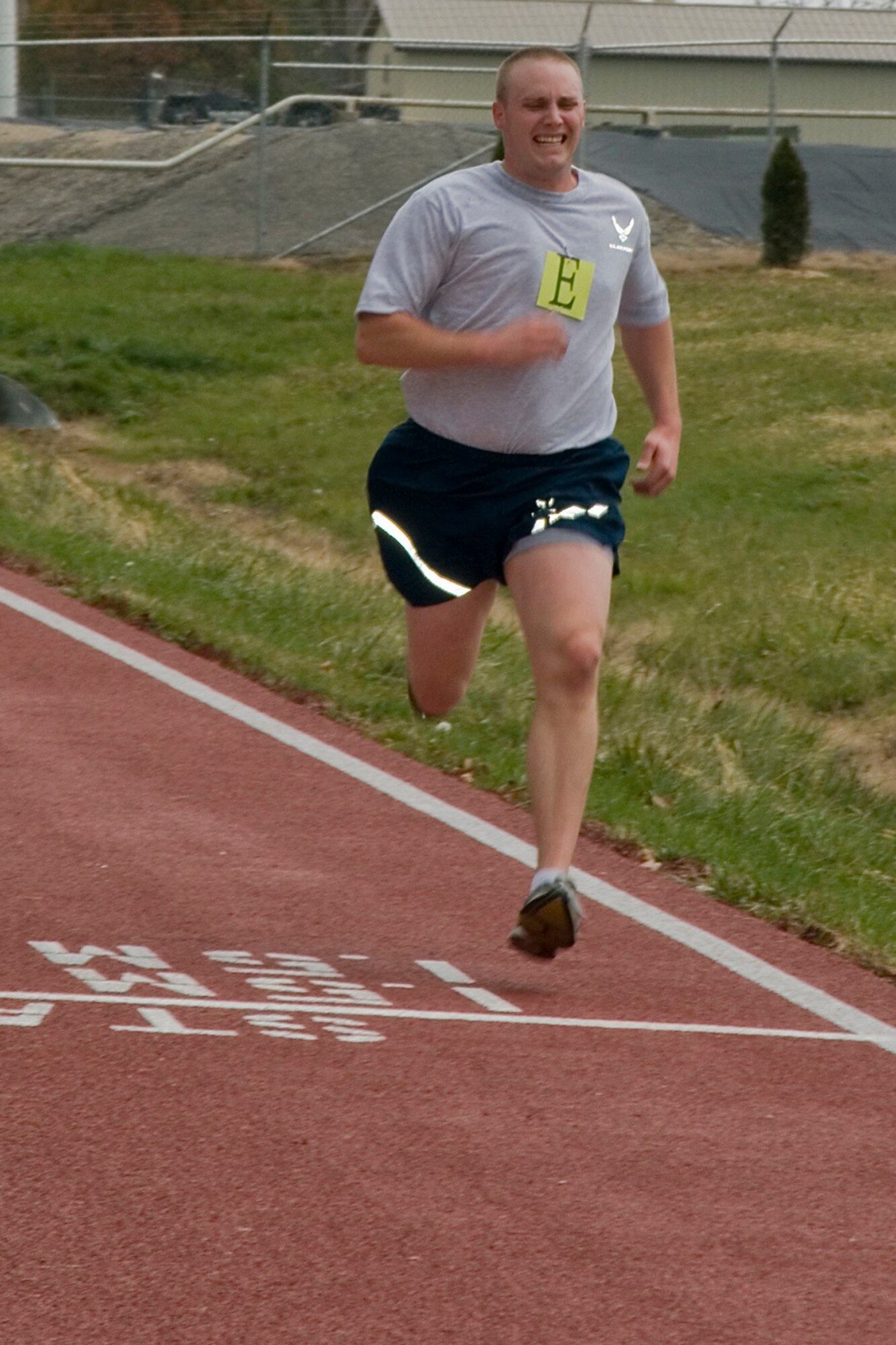 GRISSOM AIR RESERVE BASE, Ind. -- Staff Sgt. Daniel Hubbard, 434th Aircraft Maintenance Squadron aircraft hydraulic systems apprentice, crosses the finish line on Grissom's new running track here Nov. 3. The rubberized track was recently opened, and is located directly across the base fitness center off of Doc Evans Avenue. (U.S. Air Force photo/Senior Airman Jami K. Lancette)