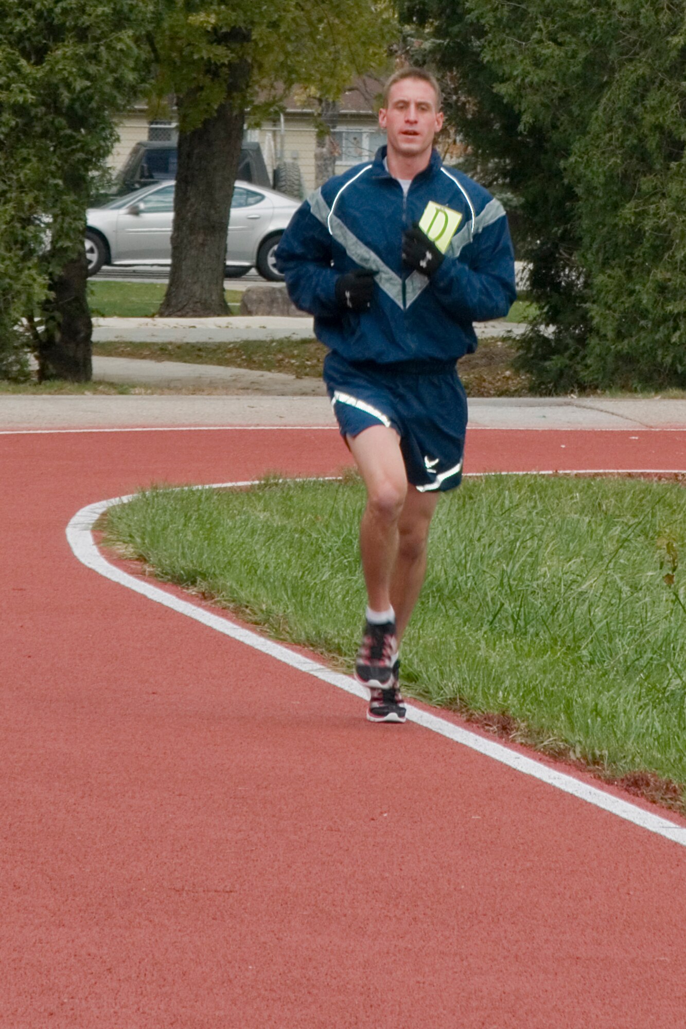 GRISSOM AIR RESERVE BASE, Ind. -- Senior Airman Austin Cullison, 434th Aircraft maintenance Squadron aircraft electrical and environmental systems specialist, runs his first physical fitness test on Grissom's new outdoor track here Nov. 3. The rubberized track was recently opened, and is located directly across the base fitness center off of Doc Evans Avenue. (U.S. Air Force photo/Senior Airman Jami K. Lancette)