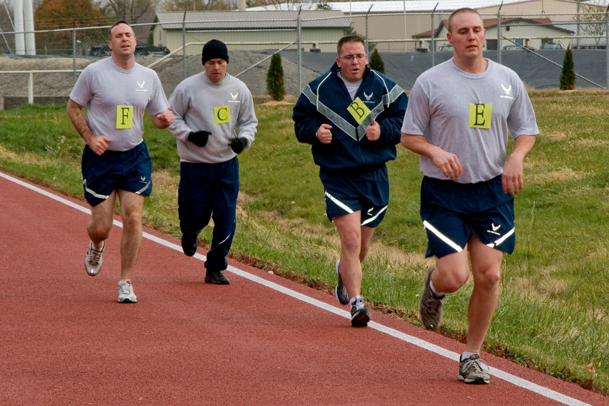 GRISSOM AIR RESERVE BASE, Ind. -- Members of the 434th Air Refueling Wing finish their first lap of their physical fitness test on Grissom's new track Nov. 3. The rubberized track was recently opened, and is located directly across the base fitness center off of Doc Evans Avenue. (U.S. Air Force photo/Senior Airman Jami K. Lancette)