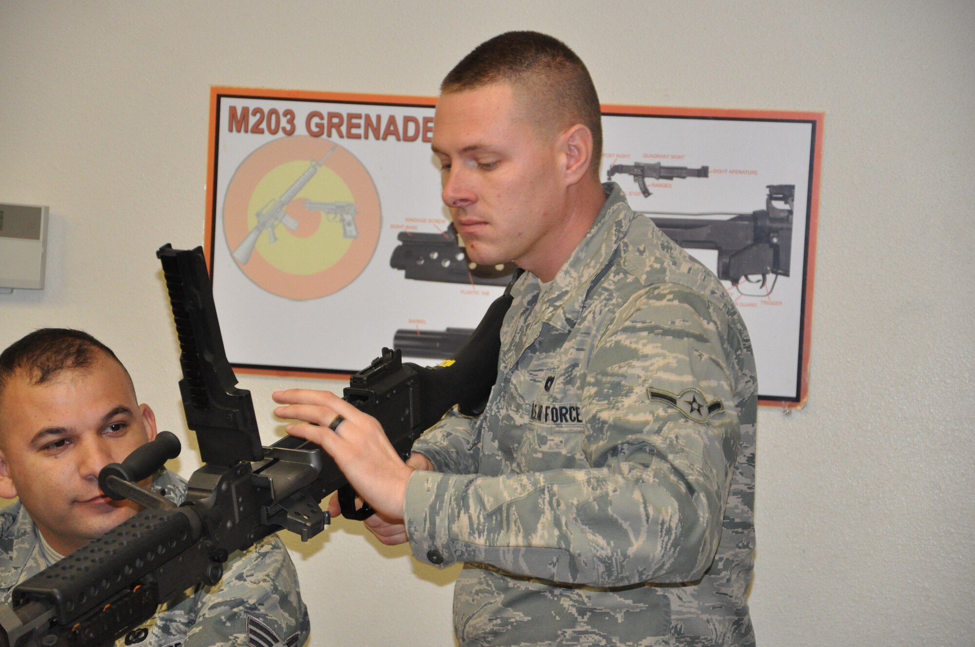 Airman Jospeh Wismann of the 940th Security Forces Squadron checks the chamber on a M240 to ensure it is clear during instruction held on Saturday of the December Unit Training Assembly at Beale Air Force Base, Calif.  The 940th SFS held heavy weapons training during the UTA to keep their war fighters up to date on required weapons qualifications.  (U.S. Air Force photo/ Senior Airman Adam Hamar)