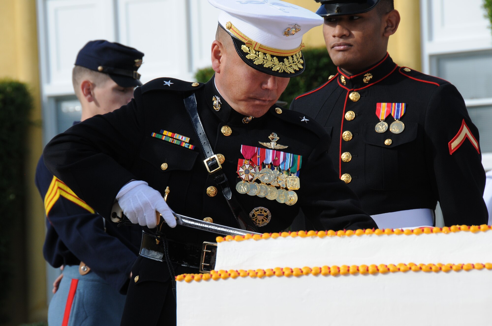 Brig. Gen. Daniel D. Yoo, Commanding General, Western Recruiting Region, Marine Corps Recruit Depot, San Diego, Calif., cuts a birthday cake Nov. 9, 2012, in honor of the Marine Corps' 237th birthday. Fifty employers from New Mexico and Arizona were given an up-close view of the military in a Joint Boss Lift with the Employer Support of the Guard and Reserve. As part of the trip, the employers watched the flag ceremony and Marine Corps graduation. (U.S. Air Force photo by Tech. Sgt. Susan Gladstein/Released)
