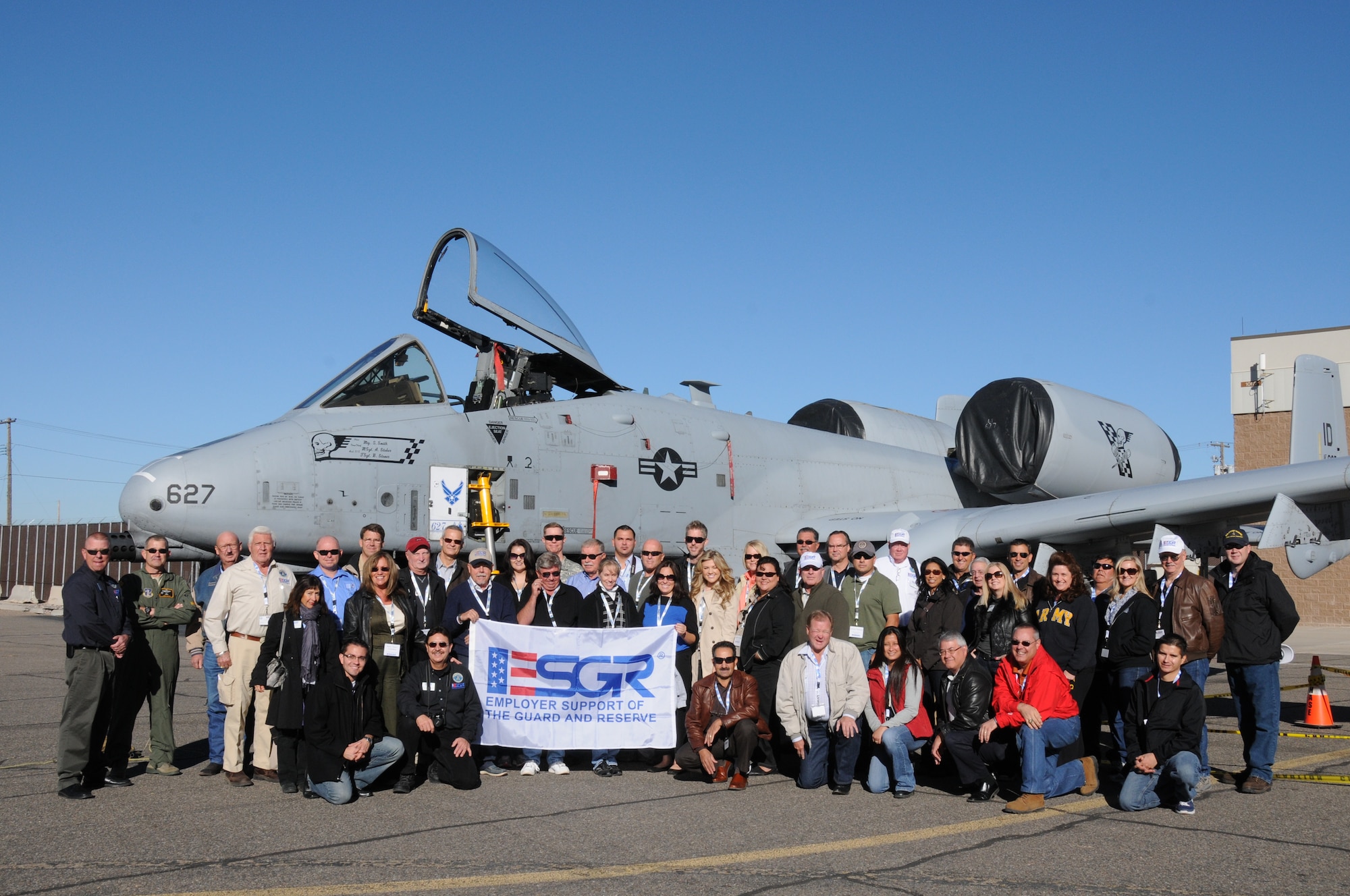 Employers from New Mexico and Arizona pose for a group photo Nov. 7, 2012, in front of an A-10 Thunderbolt II at Kirtland Air Force Base, N.M., prior to taking off for San Diego for a Joint Boss Lift with the Employer Support of the Guard and Reserve. The ESGR’s mission is to help develop and promote employer support of the Guard and Reserve service by advocating relevant initiatives, recognizing outstanding support, increasing awareness of applicable laws, and resolving conflict between employers and service members. (U.S. Air Force photo by Tech. Sgt. Susan Gladstein/Released)