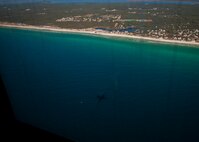 A 919th Special Operations Wing MC-130E Combat Talon I flies over the Gulf of Mexico coastline during a local area sortie Dec. 1.  Talons are scheduled to disappear from the Duke Field flightline by Oct. 2013.  They are being replaced by smaller aviation foreign internal defense aircraft. (U.S. Air Force photo/Tech. Sgt. Samuel King Jr.)