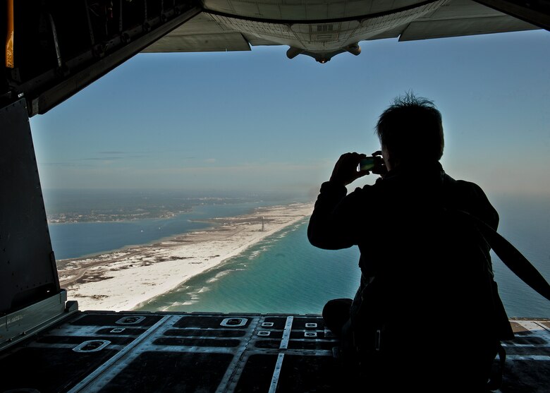 An employer of a 919th Special Operations Wing reservist checks out the view of the Emerald Coast from the back of a MC-130E Combat Talon I during an employer-day tour at Duke Field, Fla. Dec. 1.  The employers attended the tour for a better understanding of how their workers contribute to the Air Force and special operations mission.  (U.S. Air Force photo/Tech. Sgt. Samuel King Jr.)