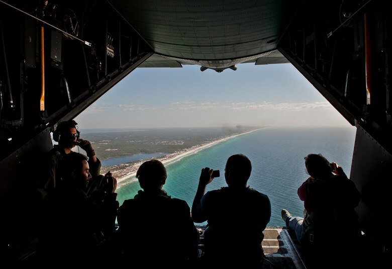 Employers of 919th Special Operations Wing reservists check out the view of the Emerald Coast from the back of a MC-130E Combat Talon I during an employer-day tour at Duke Field, Fla. Dec. 1.  The employers attended the tour for a better understanding of how their workers contribute to the Air Force and special operations mission.  (U.S. Air Force photo/Tech. Sgt. Samuel King Jr.)