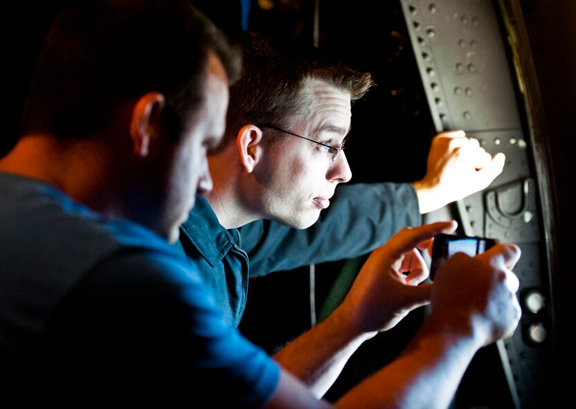 An employer of a 919th Special Operations Wing reservist checks out the view of the Emerald Coast from the window of a MC-130E Combat Talon I during an employer-day tour at Duke Field, Fla. Dec. 1.  The employers attended the tour for a better understanding of how their workers contribute to the Air Force and special operations mission.  (U.S. Air Force photo/Tech. Sgt. Samuel King Jr.)