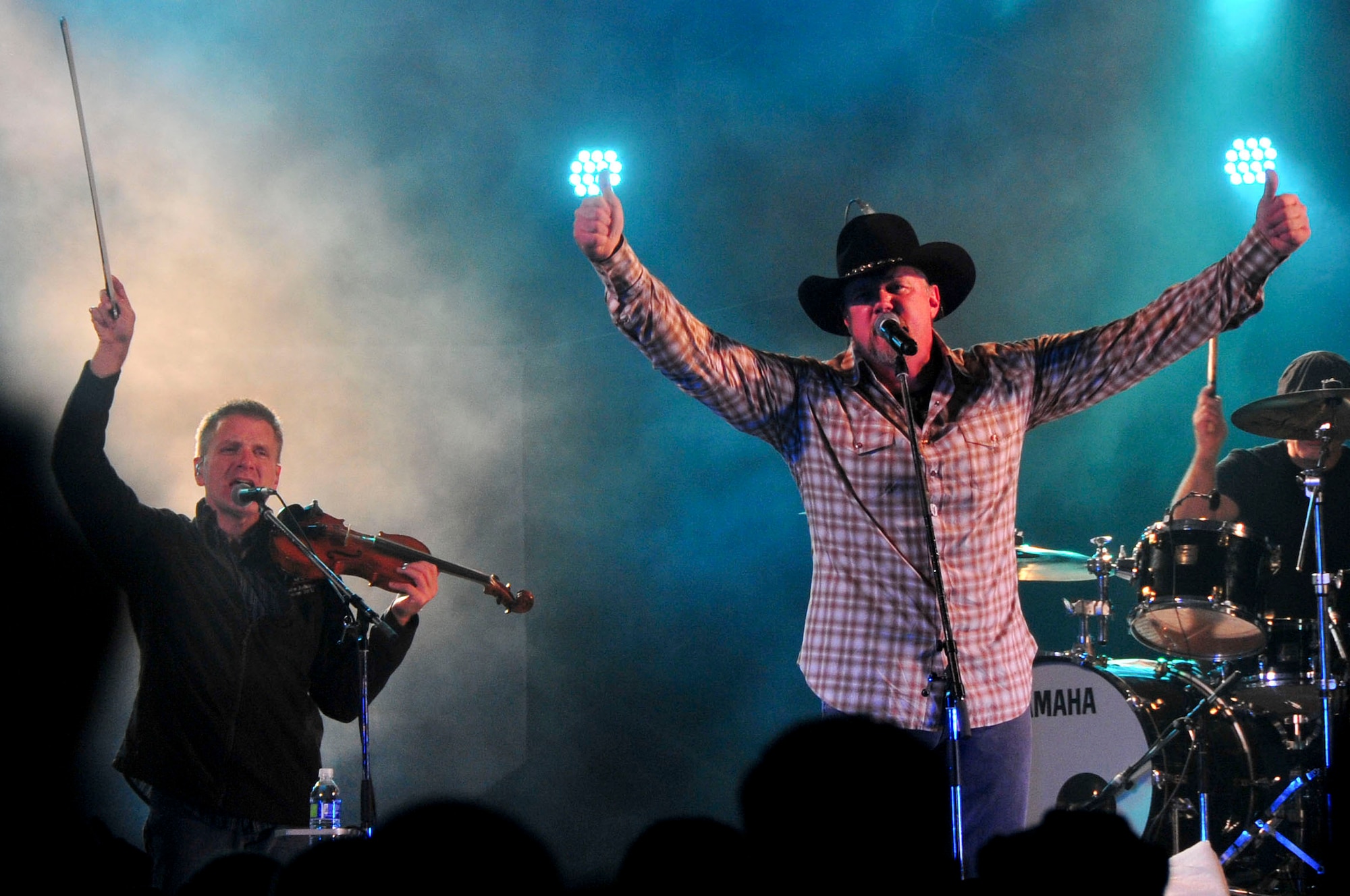 Country music artist, Trace Adkins performs for service members and their families at an 18th Force Support Squadron and USO-hosted concert in the Schilling community center parking lot on Kadena Air Base, Japan Dec. 1, 2012. The country music star performed a variety of songs and thanked the crowd for their service. (U.S. Air Force photo/Staff Sgt. Darnell T. Cannady)  